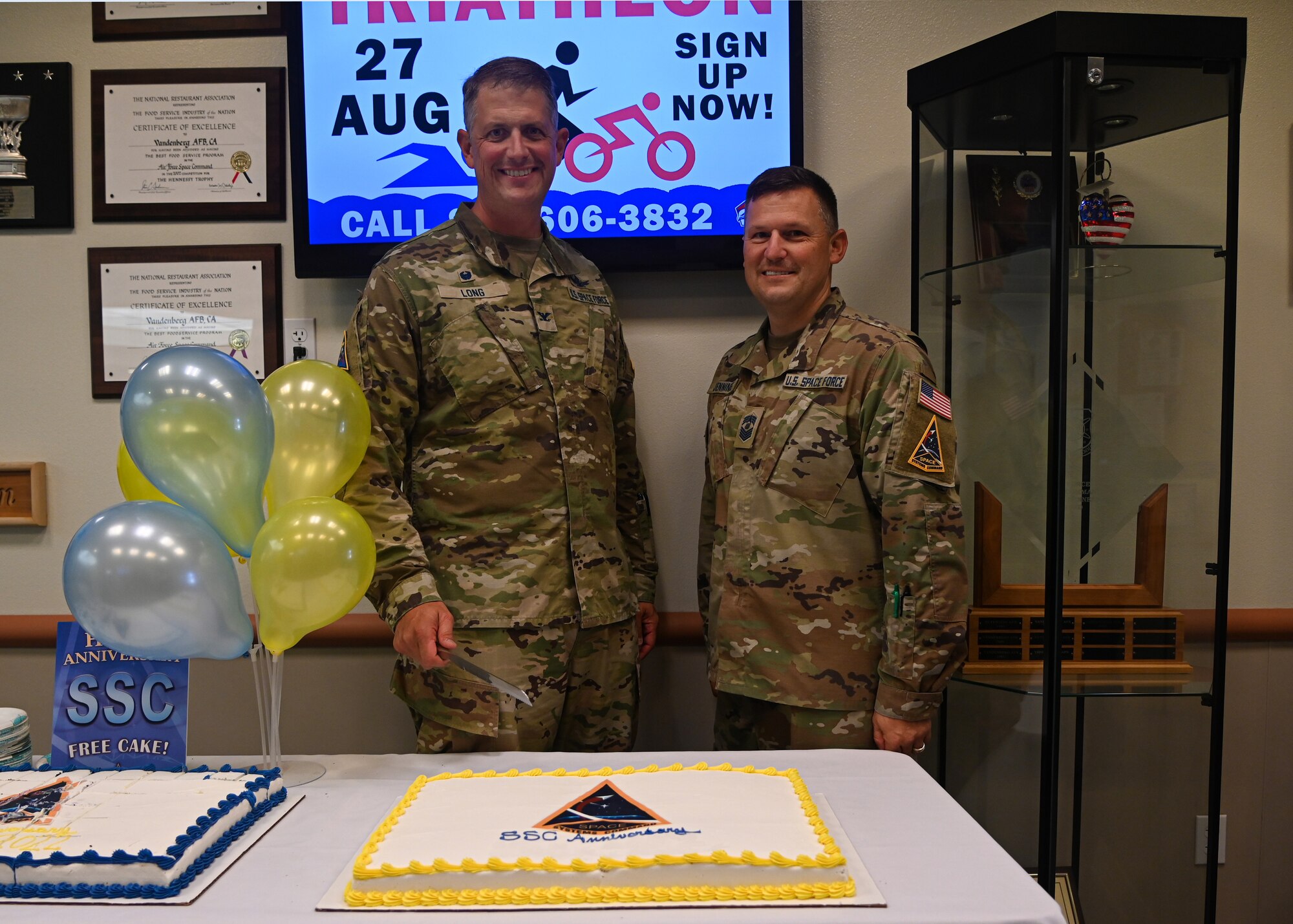 U.S. Space Force Col. Robert Long, left, Space Launch Delta 30 commander, poses for a photo with U.S. Space Force Chief Master Sgt. Heath Jennings, right, Space Launch Delta 30 Senior Enlisted Leader, at the Breakers Dining Facility on Vandenberg Space Force Base, Calif., Aug. 12, 2022. Space Systems Command is the Major Command for Space Launch Delta 30, Space Launch Delta 45 in Florida, and Space Base Delta 3 in Los Angeles, Calif.