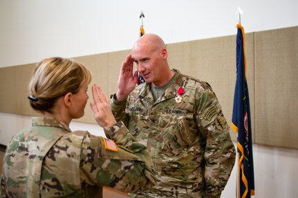 soldiers salute eachother during a change of command ceremony