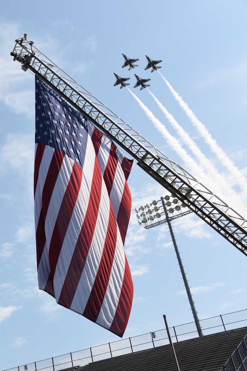 The U.S. Air Force Thunderbirds perform a fly-over of the Cramton Bowl stadium during the Officer Training School parade and graduation of "Godzilla" class 19-07 Sept. 27, 2019, Montgomery, Alabama.