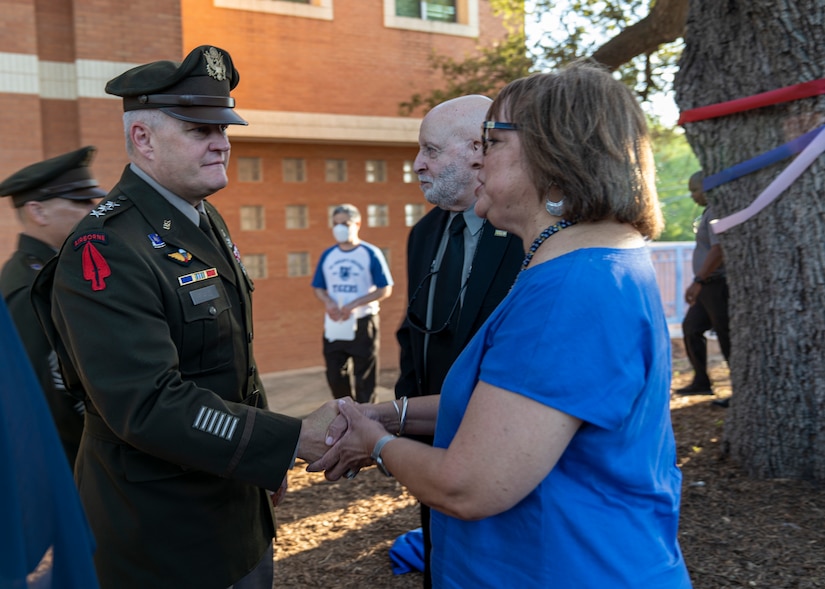 Lt. Gen. John Evans, left, commanding general of U.S. Army North, speaks to Nan Burley Richie, right, daughter of the late retired U.S. Army Col. Roy W. Burley, Sr., after the St. Philip’s College Col. Burley Oak Tree Dedication Ceremony, held on the St. Philip’s College’s campus, August 18, 2022. The 100-plus-year-old oak tree is part of the Burley homestead of the late retired U.S. Army Col. Roy W. Burley, Sr., for many generations. The tree now resides on the college campus with a plaque to share with future generations the legacy of “The Colonel”. (U.S. Army Photo by Bethany L. Huff)