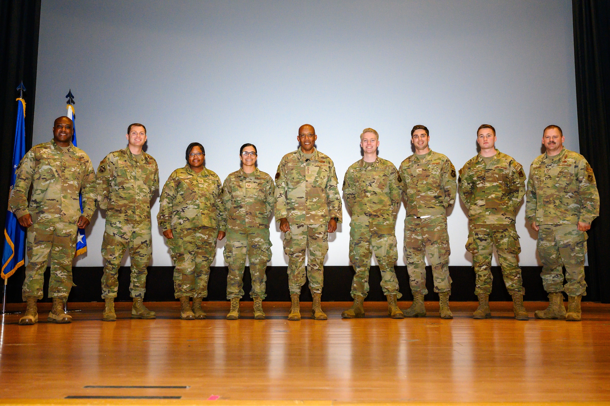 U.S. Air Force Chief of Staff Gen. CQ Brown, Jr. poses for a group photo with Airmen assigned to the 354th Fighter Wing during a visit to Eielson Air Force Base, Alaska, Aug. 12, 2022.