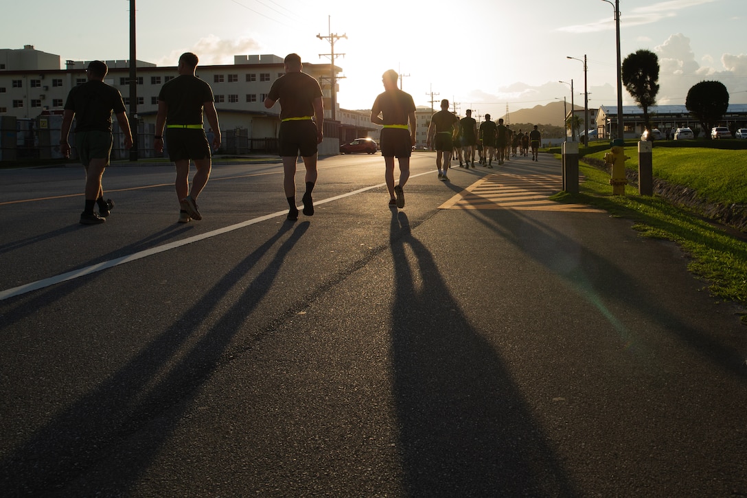 U.S. Marines with 3d Marine Division prepare to start a physical fitness test during a squad competition on Camp Schwab, Okinawa, Japan, May 22, 2022. The week-long competition was held to test squads from across the Marine Corps in their mastery of warfighting skills. (U.S. Marine Corps photo by Lance Cpl. Michael Taggart)