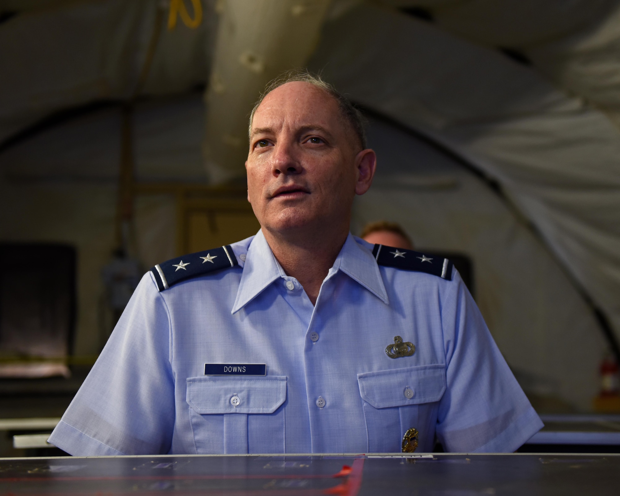 U.S. Air Force Maj. Gen. Michael Downs, Joint Staff deputy director for intelligence, surveillance and reconnaissance operations; and director, Joint Intelligence, Surveillance and Reconnaissance Operations Center; listens to a brief at Forward Operating Base Sentinel, Goodfellow Air Force Base, Texas, Aug. 17, 2022. FOB Sentinel is a simulated deployed environment operated by the staff of the 344th Military Intelligence Battalion and the 17th Training Wing to increase lethality and readiness of its students and permanent party members. (U.S. Air Force photo by Airman 1st Class Sarah Williams)