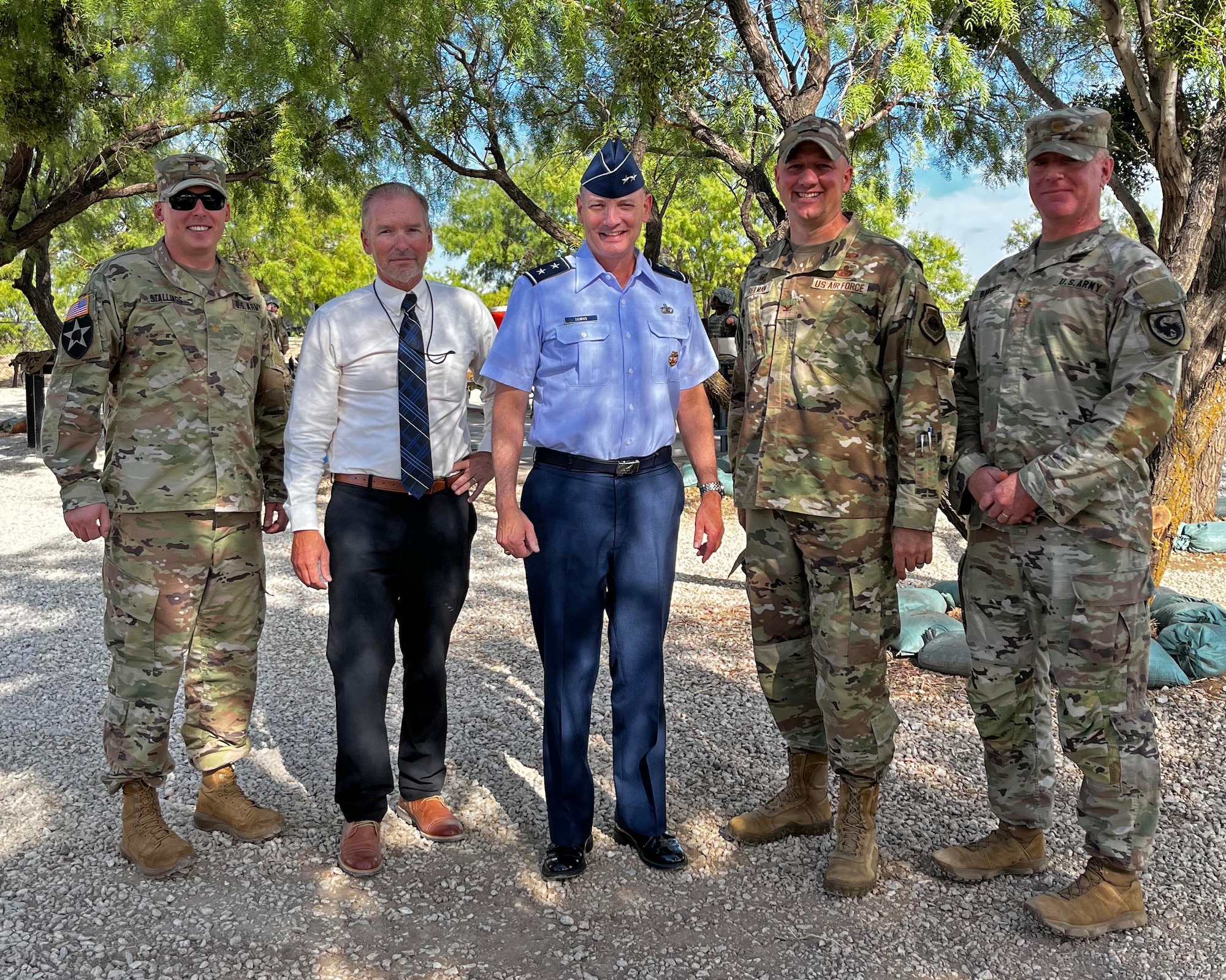 U.S. Air Force Maj. Gen. Michael Downs, Joint Staff deputy director for intelligence, surveillance and reconnaissance operations; and director, Joint Intelligence, Surveillance and Reconnaissance Operations Center; poses for a photo with Col. Matthew Reilman, 17th Training Wing commander, and members of the 344th Military Intelligence Battalion at Forward Operating Base Sentinel, Goodfellow Air Force Base, Texas, Aug. 17, 2022. Downs was the former 17th TRW commander from June 2015 - Aug. 2017. (U.S. Air Force photo by Airman 1st Class Sarah Williams)