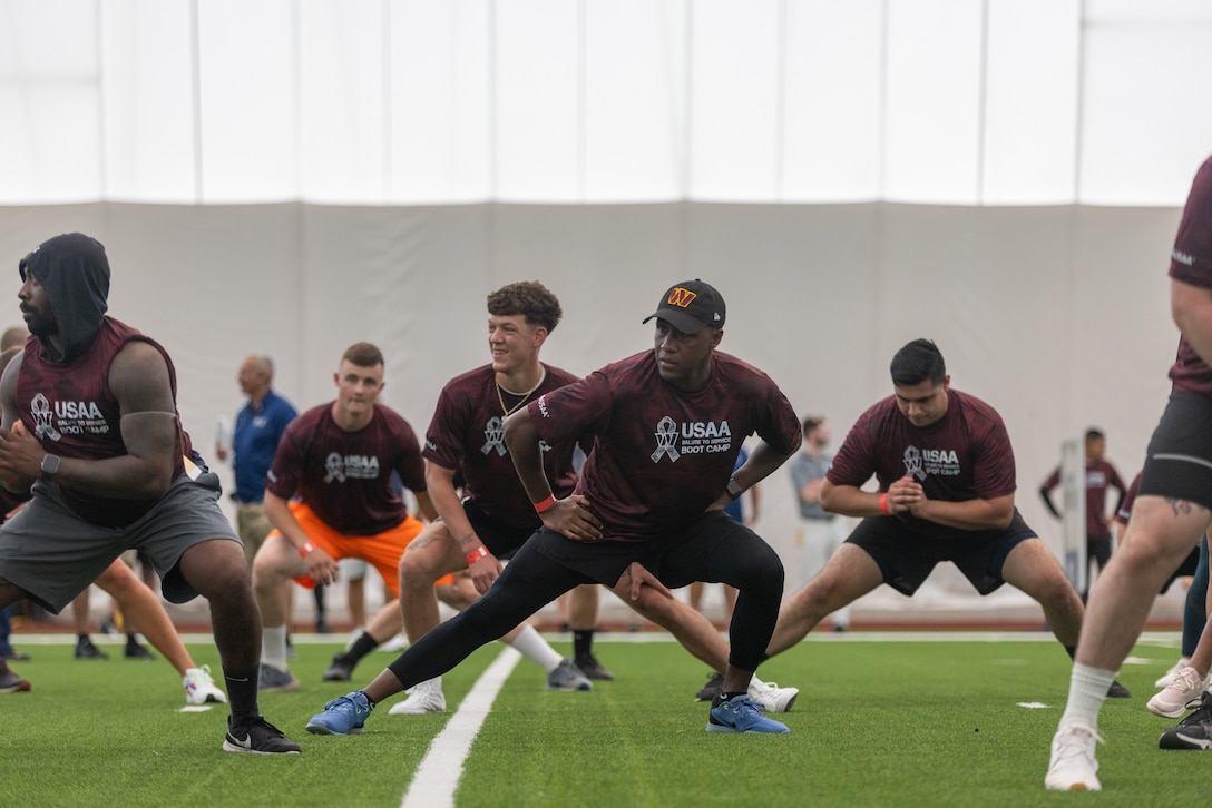 U.S. service members stationed at Marine Corps Base Quantico, Naval District Washington participate in a National Football League (NFL) combine at the Salute to Service Boot Camp hosted by the Washington Commanders at the Inova Sports Performance Center, Ashburn, Virginia, Aug. 16, 2022. Military members joined the Commanders and members of USAA for a special training camp event that allowed servicemen and women to work out on the Commanders practice fields. (U.S. Marine Corps photo by Cpl. Eric Huynh)