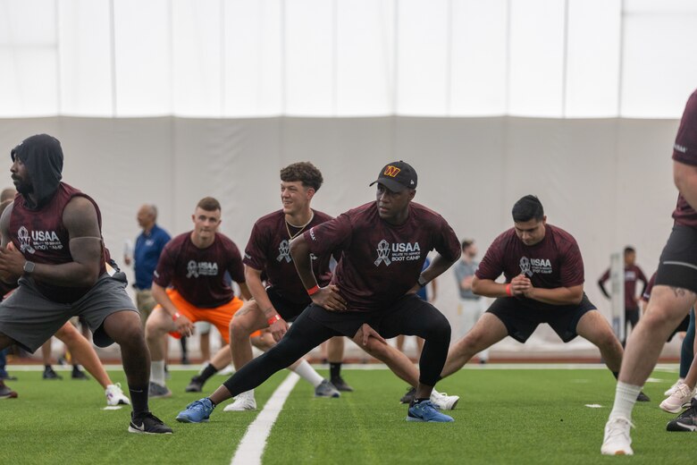 U.S. service members stationed at Marine Corps Base Quantico, Naval District Washington participate in a National Football League (NFL) combine at the Salute to Service Boot Camp hosted by the Washington Commanders at the Inova Sports Performance Center, Ashburn, Virginia, Aug. 16, 2022. Military members joined the Commanders and members of USAA for a special training camp event that allowed servicemen and women to work out on the Commanders practice fields. (U.S. Marine Corps photo by Cpl. Eric Huynh)