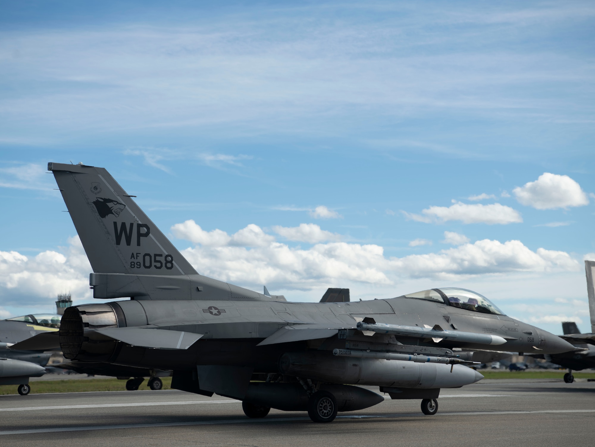 An F-16 Fighting Falcon with the 80th Fighter Squadron waits to taxi during RED FLAG-ALASKA 22-3, at Eielson Air Force Base, Alaska, Aug. 12, 2022. The 80th FS and 35th Fighter Generation Squadron completed more than 150 training missions during RF-A 22-3, working jointly and bilaterally to execute interoperable missions in a simulated contingent environment. (U.S. Air Force photo by Staff Sgt. Sadie Colbert)