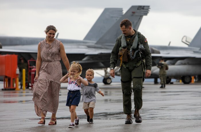 U.S. Navy Lt. Van Den Berg, an F/A-18 Super Hornet pilot assigned to Carrier Air Wing 5, reunites with his family after returning to Marine Corps Air Station Iwakuni, August 17, 2022.