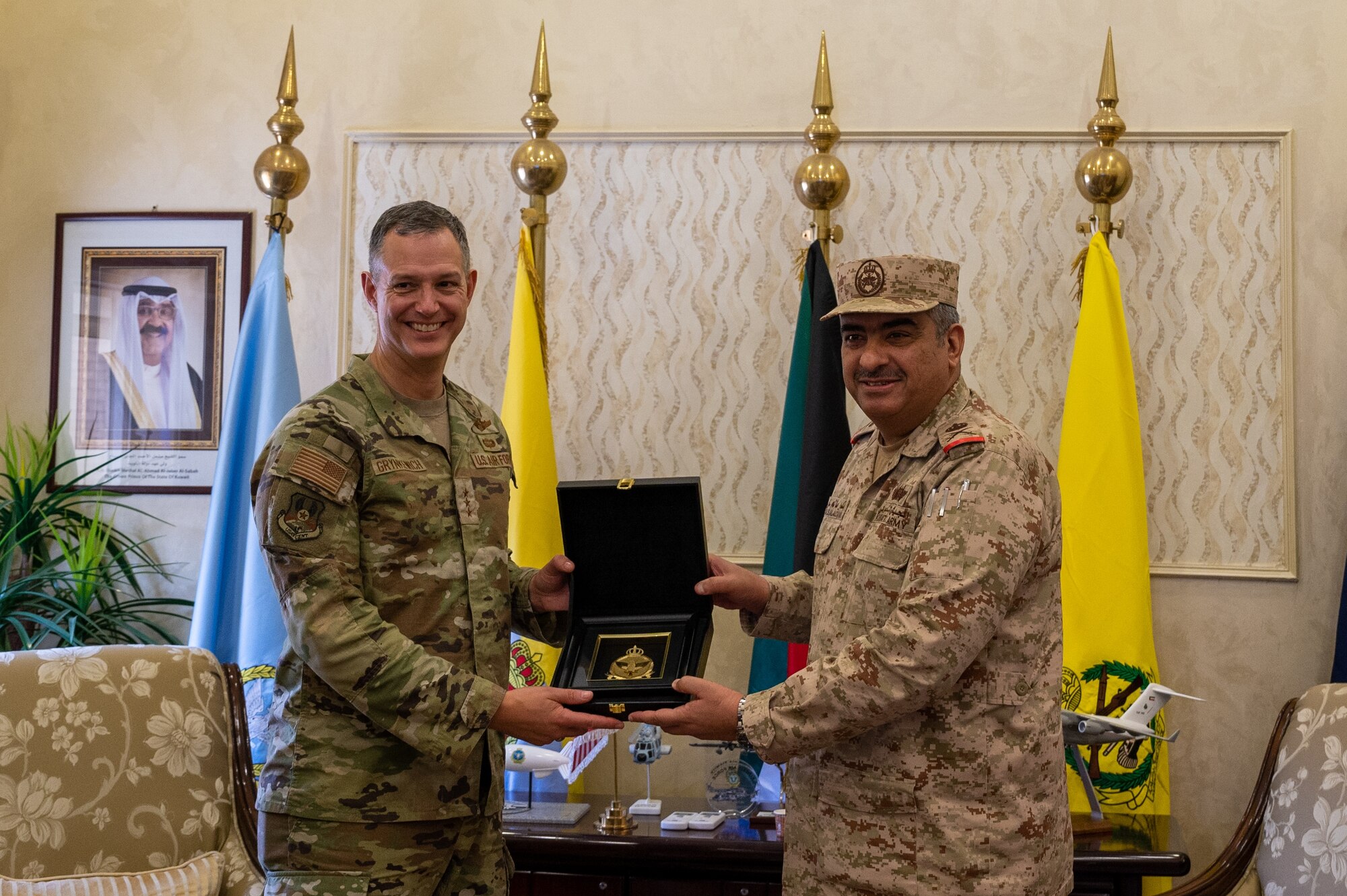 U.S. Air Force Lt. Gen. Alexus G. Grynkewich, left, Ninth Air Force (Air Forces Central) commander, receives a gift from Maj. Gen. Bandar Salem Al-Muzayan, right, acting Kuwait Air Force command chief at the Kuwait Air Force Headquarters, Kuwait, Aug. 17, 2022. During the visit, Grynkewich met with Kuwaiti military leaders to discuss the importance of resolute partnerships within the U.S. Central Command area of responsibility. (U.S. Air Force photo by Senior Airman Dominic Tyler)