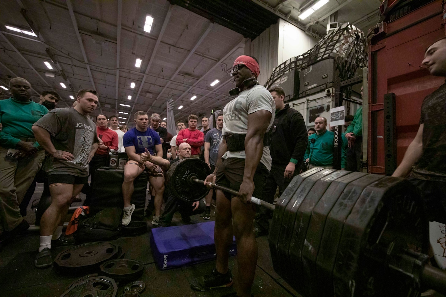 Chief Electrician's Mate Rubin Fletcher participates in a deadlifting competition hosted by the Morale, Welfare, and Recreation division in the hangar bay, Aug. 18, 2022.