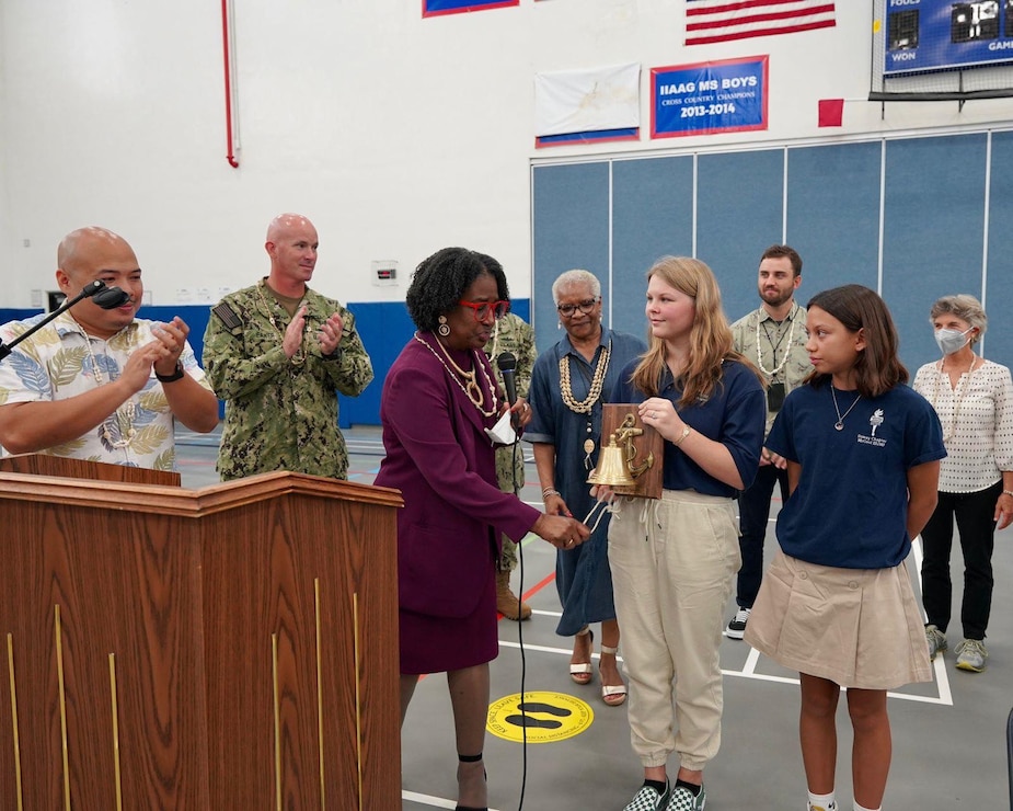 NAVAL BASE GUAM (Aug. 22, 2022) - U.S. Naval Base Guam (NBG) Executive Officer Cmdr. Stephen Ansuini and NBG Command Master Chief Adam Eaker helped ring in the new school year for students at Cmdr. William C. McCool Elementary/Middle School Aug. 22.
