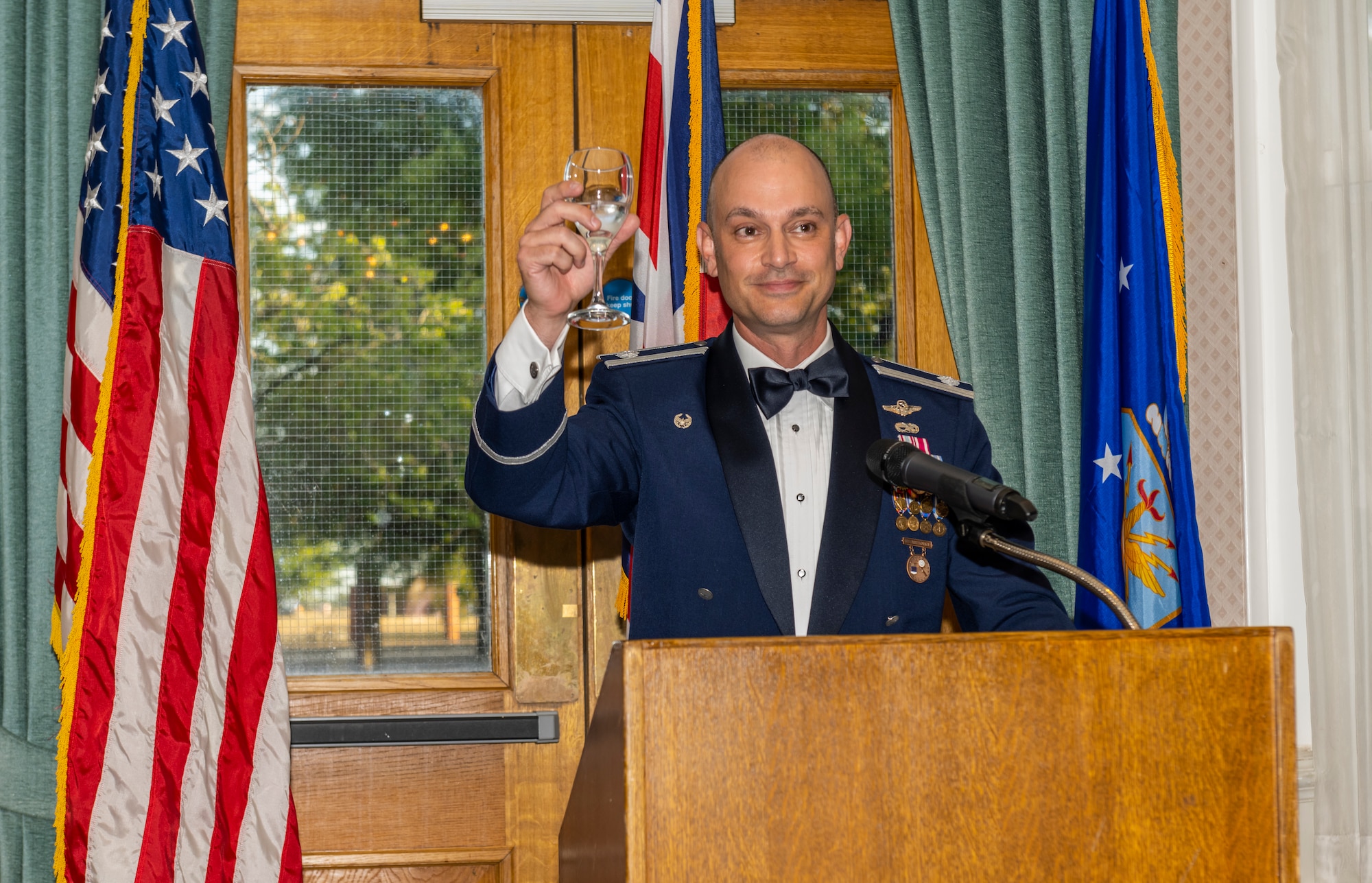 U.S. Air Force Lt. Col. Jonathan Beha, 95th Reconnaissance Squadron commander, raises a toast during the 95th RS’s 105th anniversary celebration at Royal Air Force Mildenhall, England, Aug. 19, 2022. Since 1917, the 95th RS has played a vital role in nearly every major conflict, with one of their most notable roles being as a bombardment squadron in the Doolittle Raid of 1942.