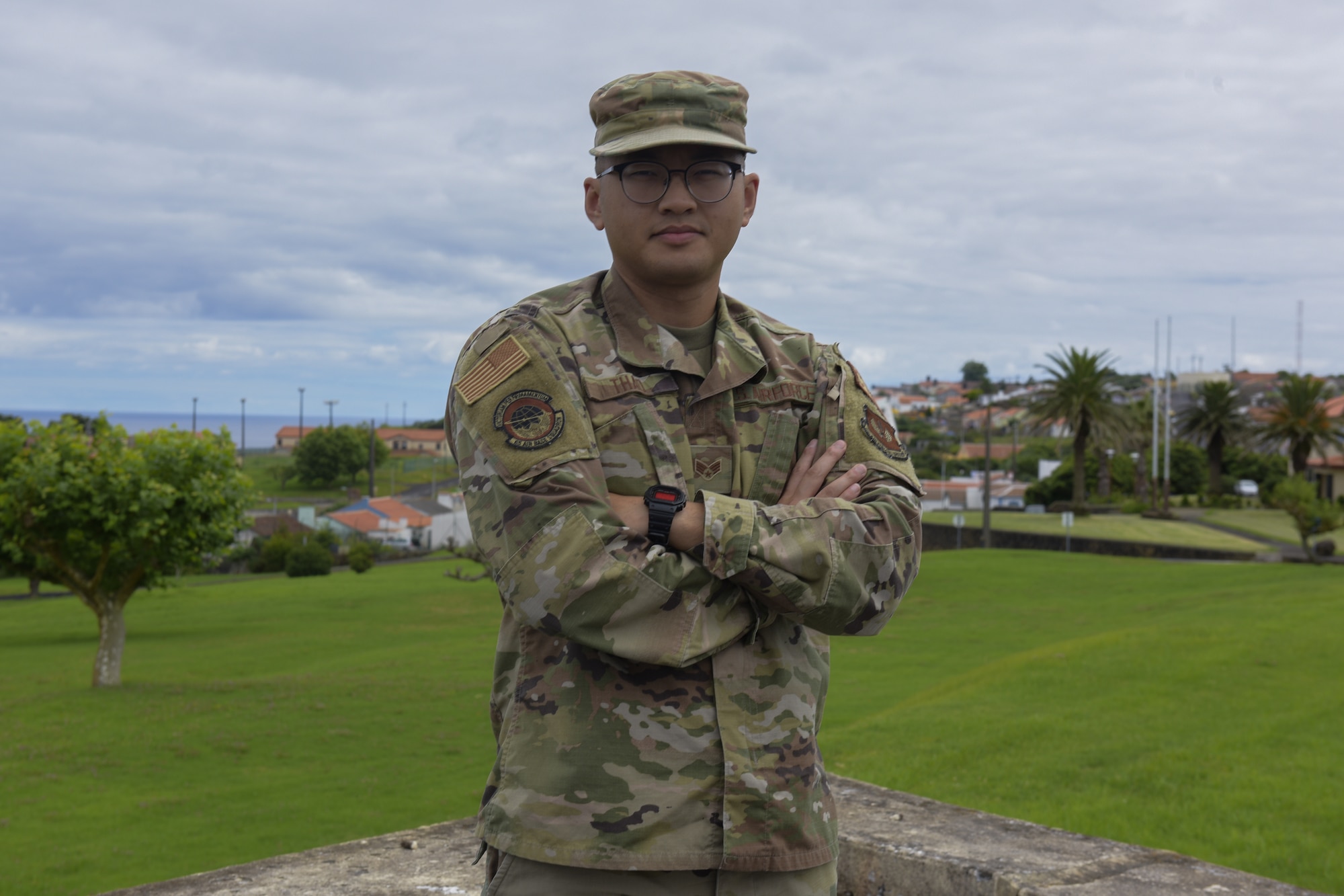 Man stands with arms crossed