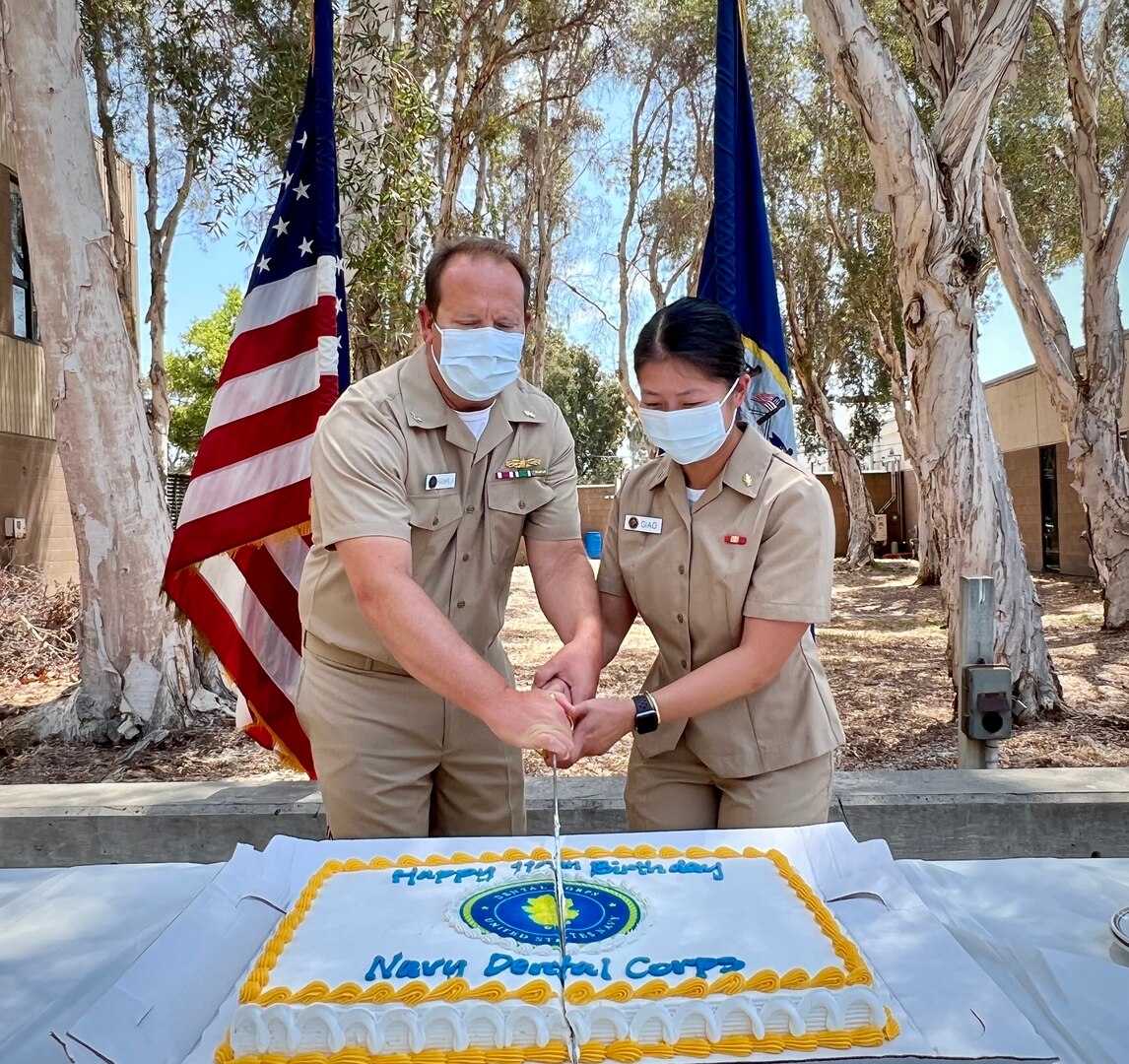 At Naval Base San Diego’s Dental Clinic’s courtyard, dentists, hygienists and staff gathered to celebrate the 110th birthday of the U.S. Navy’s Dental Corps with a cake-cutting ceremony, Aug 22 by the most senior corps member, Capt. Christopher Hanhila, Navy Medicine Readiness and Training Command (NMRTC) San Dieg