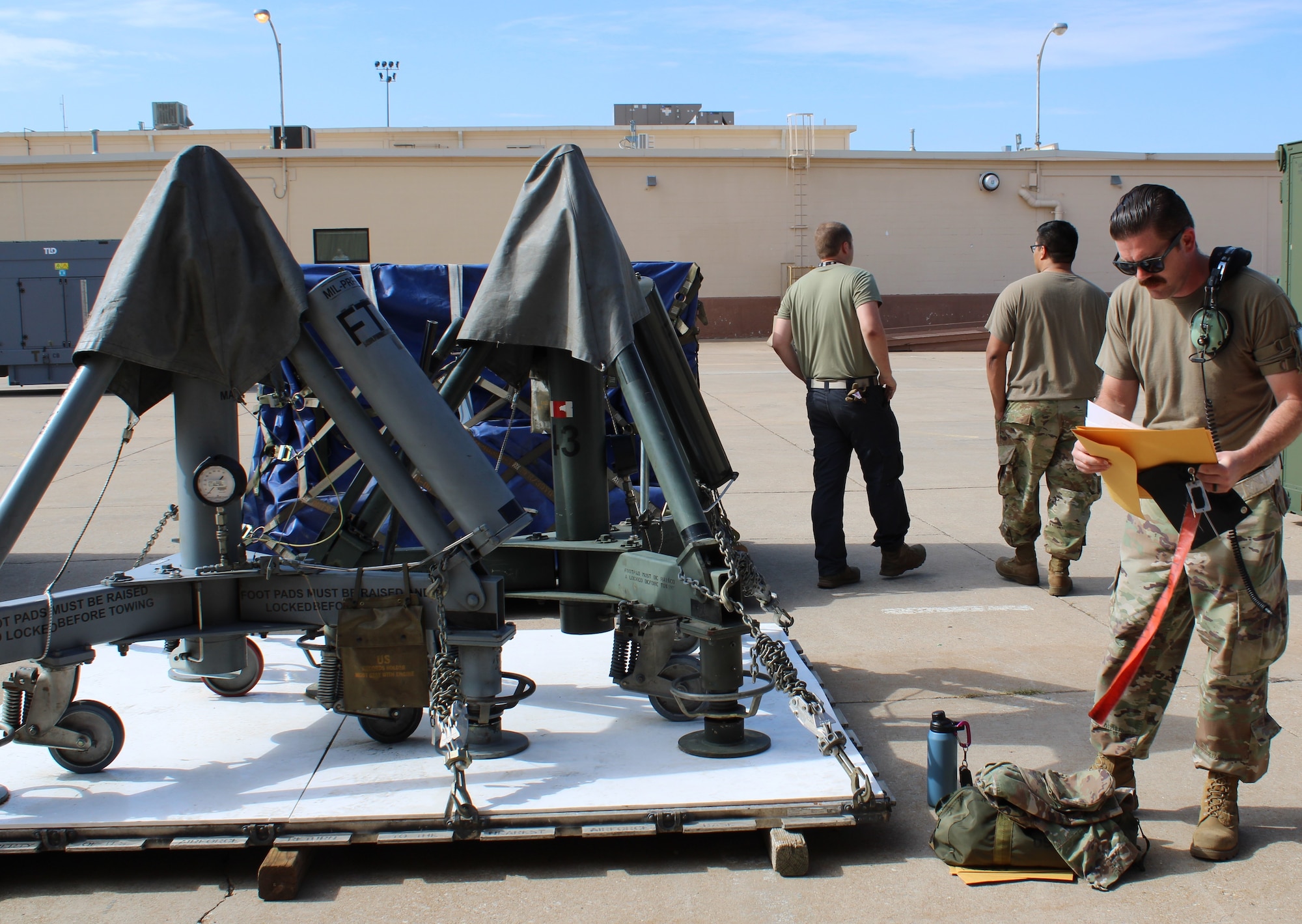 552nd Air Control Wing airman checks cargo paperwork for deployment in the Agile Thunder 22-02 exercise.