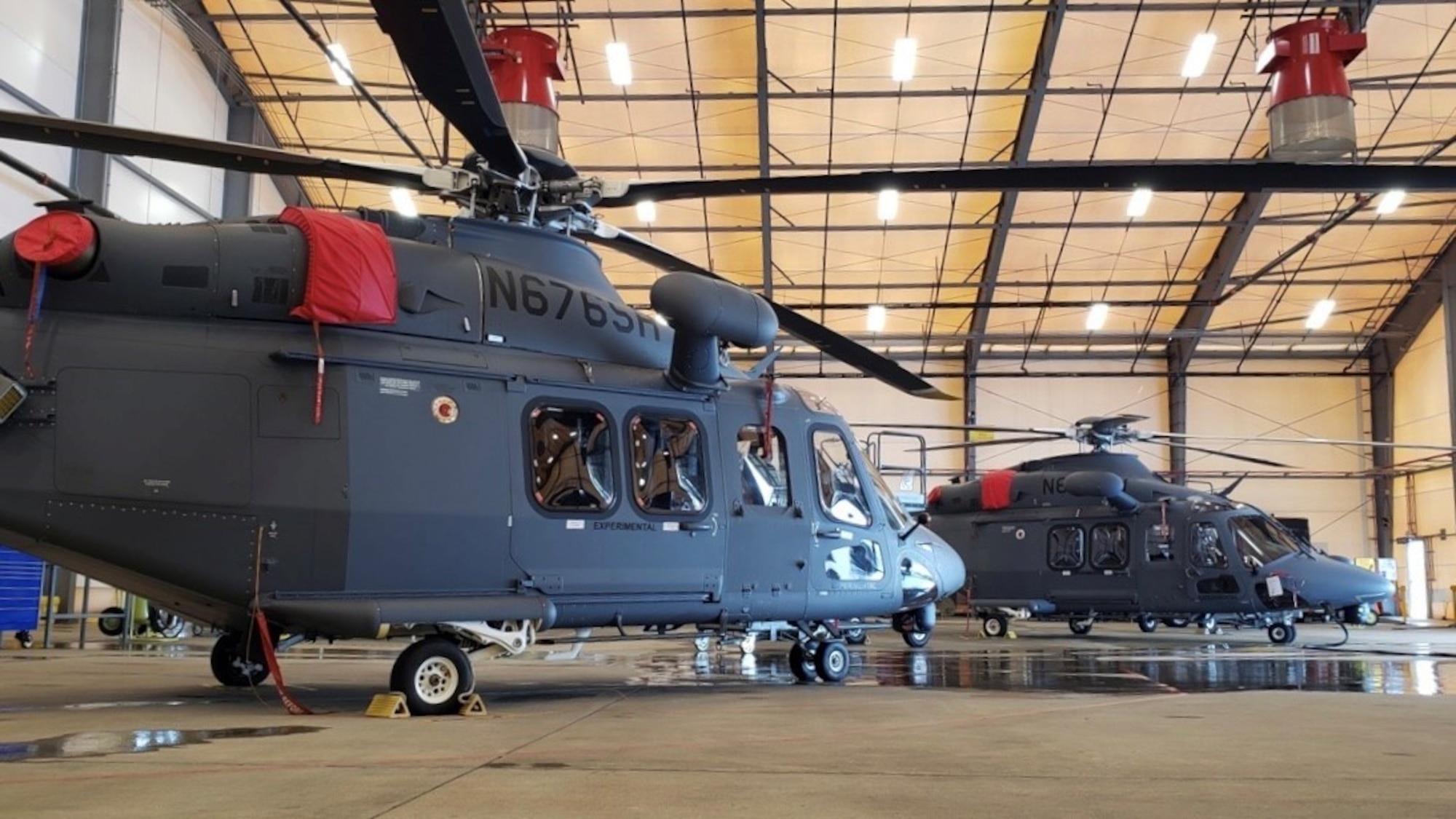 Two of the four newly acquired MH-139A Grey Wolf Helicopters pictured at Duke Field, Fla. poised to begin developmental testing as the program marks significant progress towards Milestone C.  The aircraft is set to replace the U.S Airforce’s UH-1N Huey aircraft fleet. (U.S. Air Force)