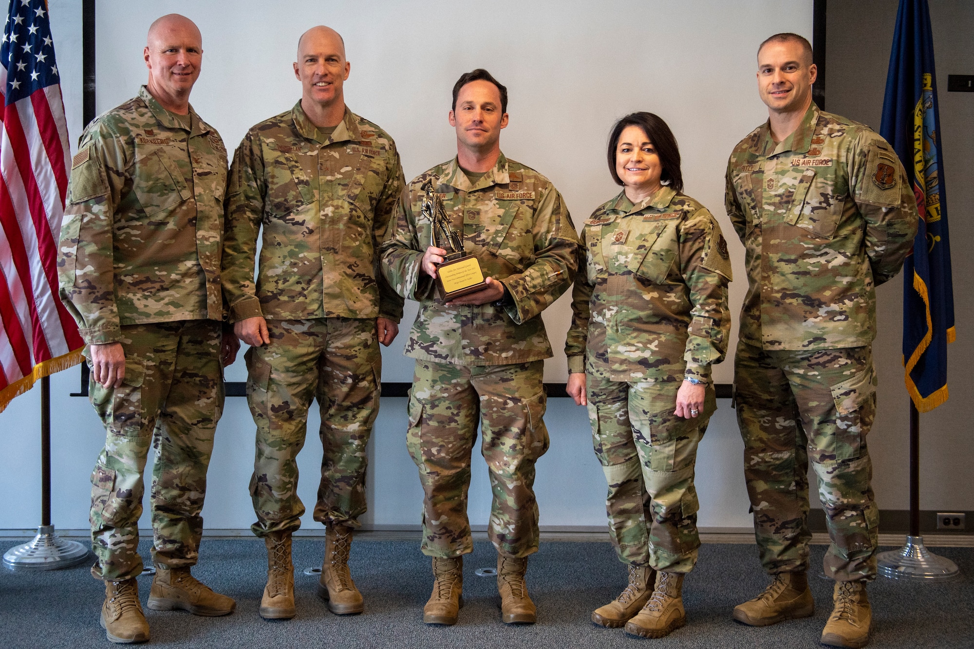 Master Sgt. Dan Keller, the chief of weapons and tactics for the 124th Air Support Operations Squadron, poses for a picture with Idaho Air National Guard and 124th Fighter Wing leadership at Gowen Field, Boise, Idaho, January 25, 2022. Keller was nominated and selected as the Idaho Air National Guard’s Outstanding Airman of the Year 2021, in the senior non-commissioned officer category. (U.S. Air National Guard photo by Senior Master Sgt. Joshua C. Allmaras)