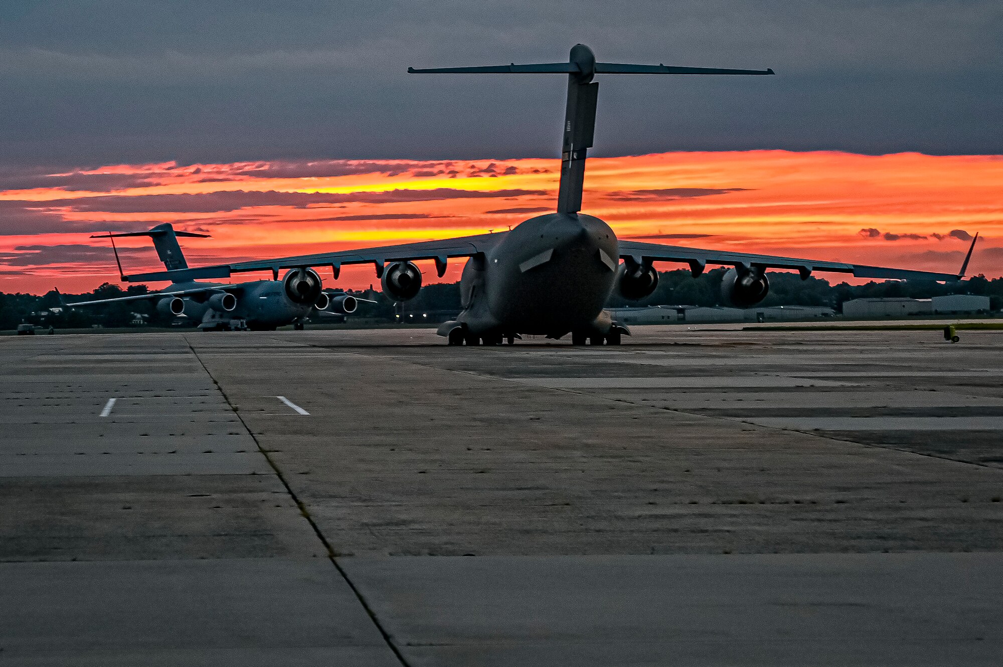 A C-17 Globemaster III assigned to the 305th Air Mobility Wing, prepares to receive the upload of Guided Multiple Launch Rocket System munitions at Joint Base McGuire-Dix-Lakehurst, N.J., Aug. 13, 2022. The munitions cargo is part of an additional security assistance package for Ukraine. The security assistance the U.S. is providing to Ukraine is enabling critical success on the battlefield against the Russian invading force.