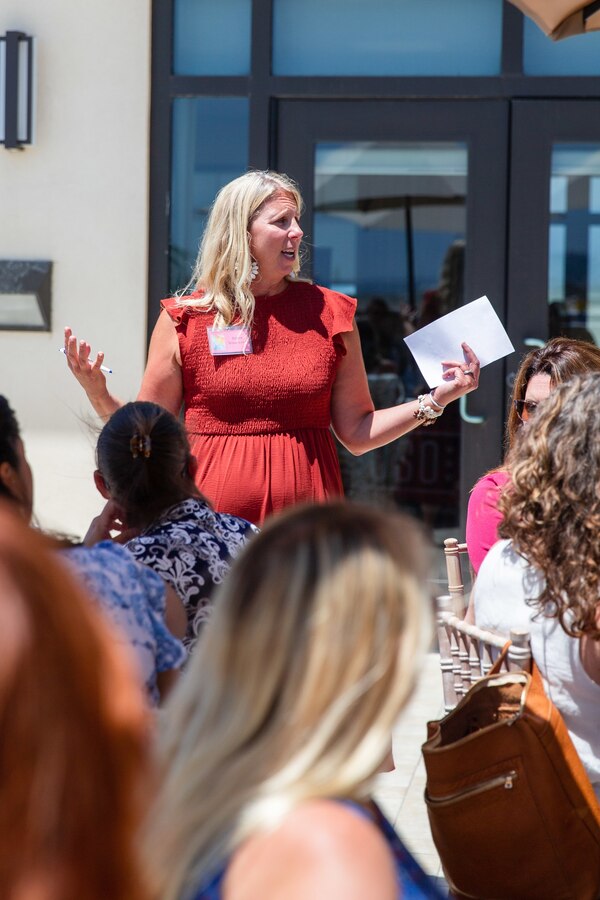 Ms. Reene Woodworth, the wife to U.S. Marine Corps Brig. Gen. Woodworth, the commanding general of Marine Corps Installations West, Marine Corps Base Camp Pendleton, speaks during an event at La Casa Del Mar on Camp Pendleton, California, Aug. 18, 2022. The event showcased the resources available to help Marine spouses and their families stationed aboard MCI-West. Resources include but are not limited to Marine Corps Family Advocacy program, United Service Organization and others. There are over 15 different resources available to families and ways to help the communities across the installations. (U.S. Marine Corps photo by Lance Cpl. Hope Straley)