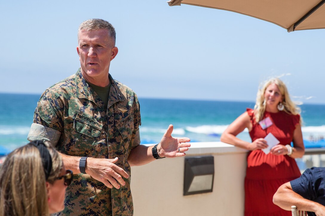 U.S. Marine Corps Brig. Gen. Woodworth, the commanding general for Marine Corps Installations West, Marine Corps Base Camp Pendleton, speaks during an event at La Casa Del Mar on Camp Pendleton, California, Aug. 18, 2022. The event showcased the resources available to help Marine spouses and their families stationed aboard MCI-West. Resources include but are not limited to Marine Corps Family Advocacy program, United Service Organization and others. There are over 15 different resources available to families and ways to help the communities across the installations. (U.S. Marine Corps photo by Lance Cpl. Straley)