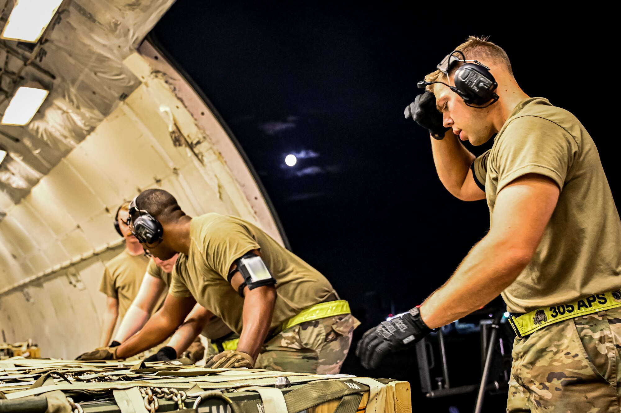 Airmen assigned to the 305th Aerial Port Squadron upload Guided Multiple Launch Rocket System munitions onboard a Boeing 767 at Joint Base McGuire-Dix-Lakehurst, N.J., Aug. 11, 2022. The munitions cargo is part of an additional security assistance package for Ukraine. The security assistance the U.S. is providing to Ukraine is enabling critical success on the battlefield against the Russian invading force. (U.S. Air Force photo by Senior Airman Matt Porter)
