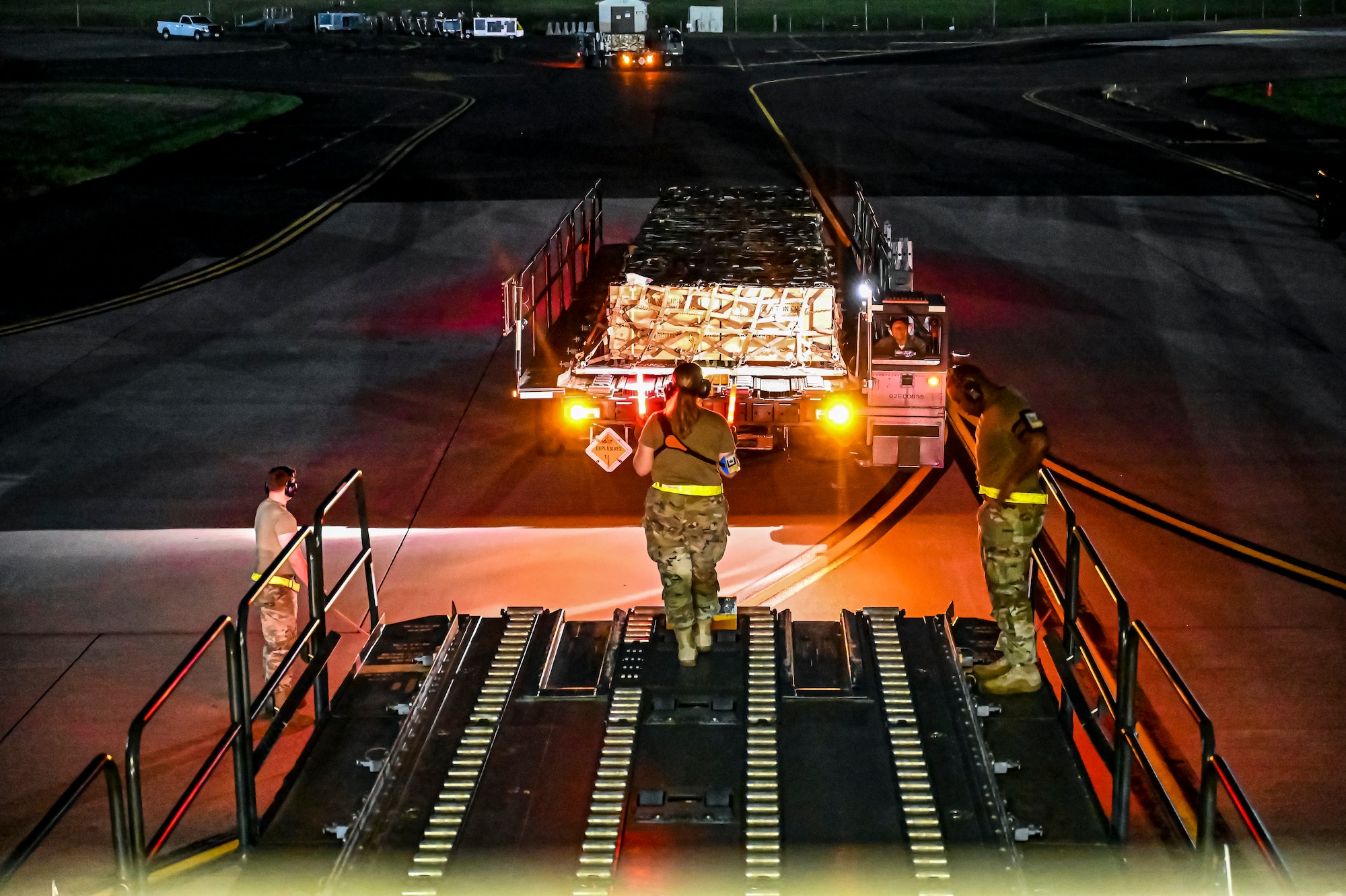 Airmen assigned to the 305th Aerial Port Squadron, prepare to upload Guided Multiple Launch Rocket System munitions onboard a Boeing 767 at Joint Base McGuire-Dix-Lakehurst, N.J., Aug. 11, 2022. The munitions cargo is part of an additional security assistance package for Ukraine. The security assistance the U.S. is providing to Ukraine is enabling critical success on the battlefield against the Russian invading force. (U.S. Air Force photo by Senior Airman Matt Porter)