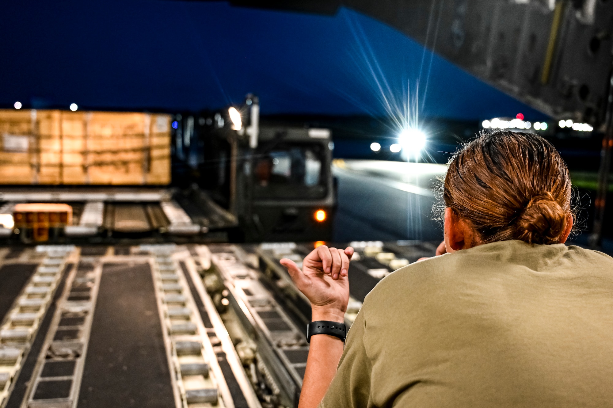Senior Airman Natasha Mundt, 14th Airlift Squadron loadmaster, prepares the upload of Guided Multiple Launch Rocket System munitions to a C-17 Globemaster III at Joint Base McGuire-Dix-Lakehurst, N.J., Aug. 13, 2022. The munitions cargo is part of an additional security assistance package for Ukraine. The security assistance the U.S. is providing to Ukraine is enabling critical success on the battlefield against the Russian invading force.  (U.S. Air Force photo by Senior Airman Matt Porter)