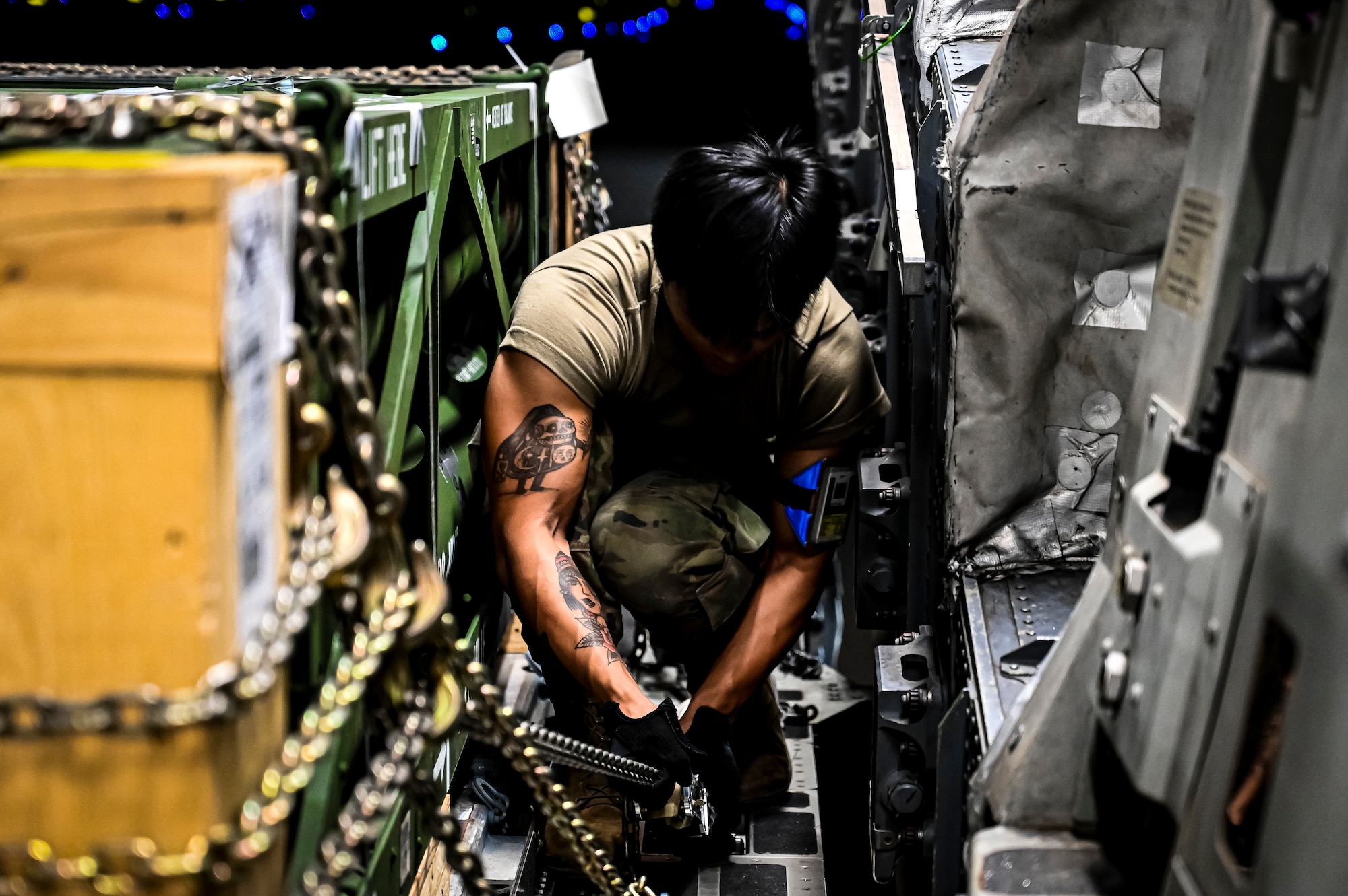 Airman 1st Class Solomon Stoddard, 305th Aerial Port Squadron air transportation, prepares an upload of Guided Multiple Launch Rocket System munitions at Joint Base McGuire-Dix-Lakehurst, N.J., Aug. 13, 2022. The munitions cargo is part of an additional security assistance package for Ukraine. The security assistance the U.S. is providing to Ukraine is enabling critical success on the battlefield against the Russian invading force. (U.S. Air Force photo by Senior Airman Matt Porter)