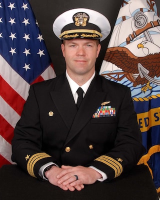Commander Joshua M. Ales