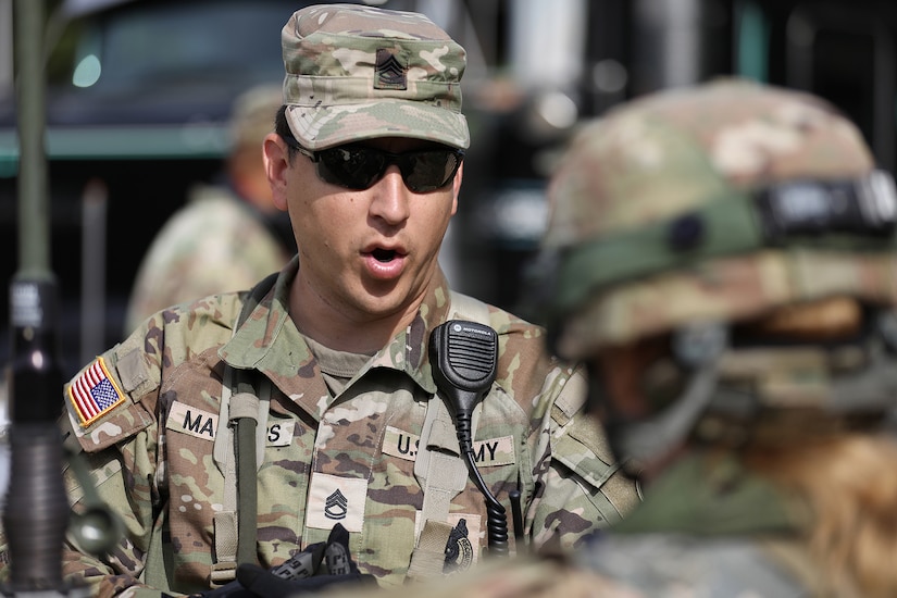 U.S. Army Reserve Sgt. First Class Steven Masters, Observer Coach Trainer, 2-361 Training Support Battalion, 85th U.S. Army Reserve Support Command, gives guidance to Soldiers from the 888th Movement Control Team during a convoy brief at CSTX 86-22-02 at Fort McCoy, Wisconsin, August 16, 2022.