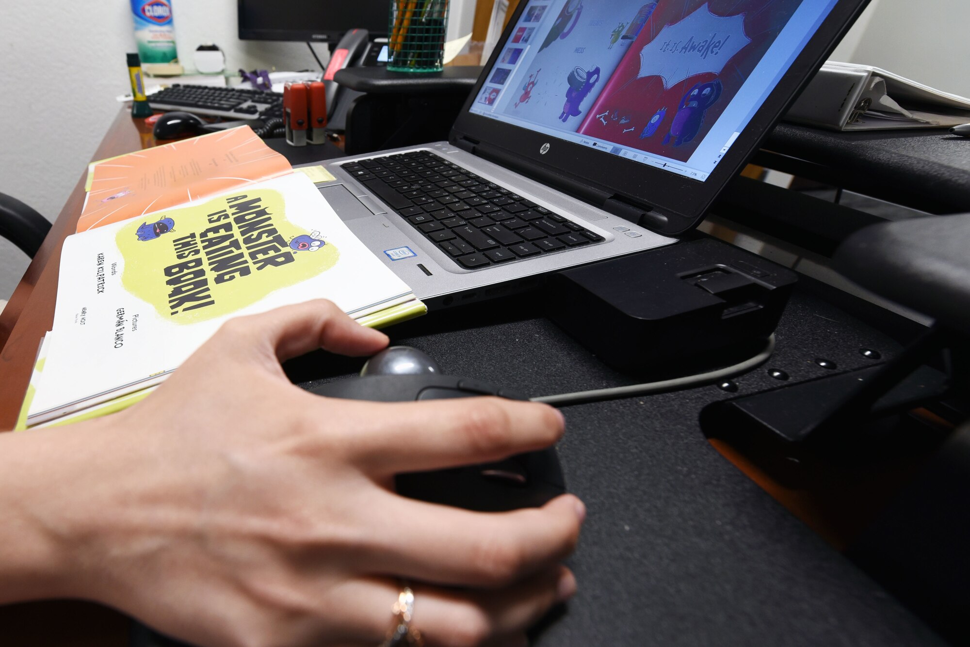 Library staff member works on computer