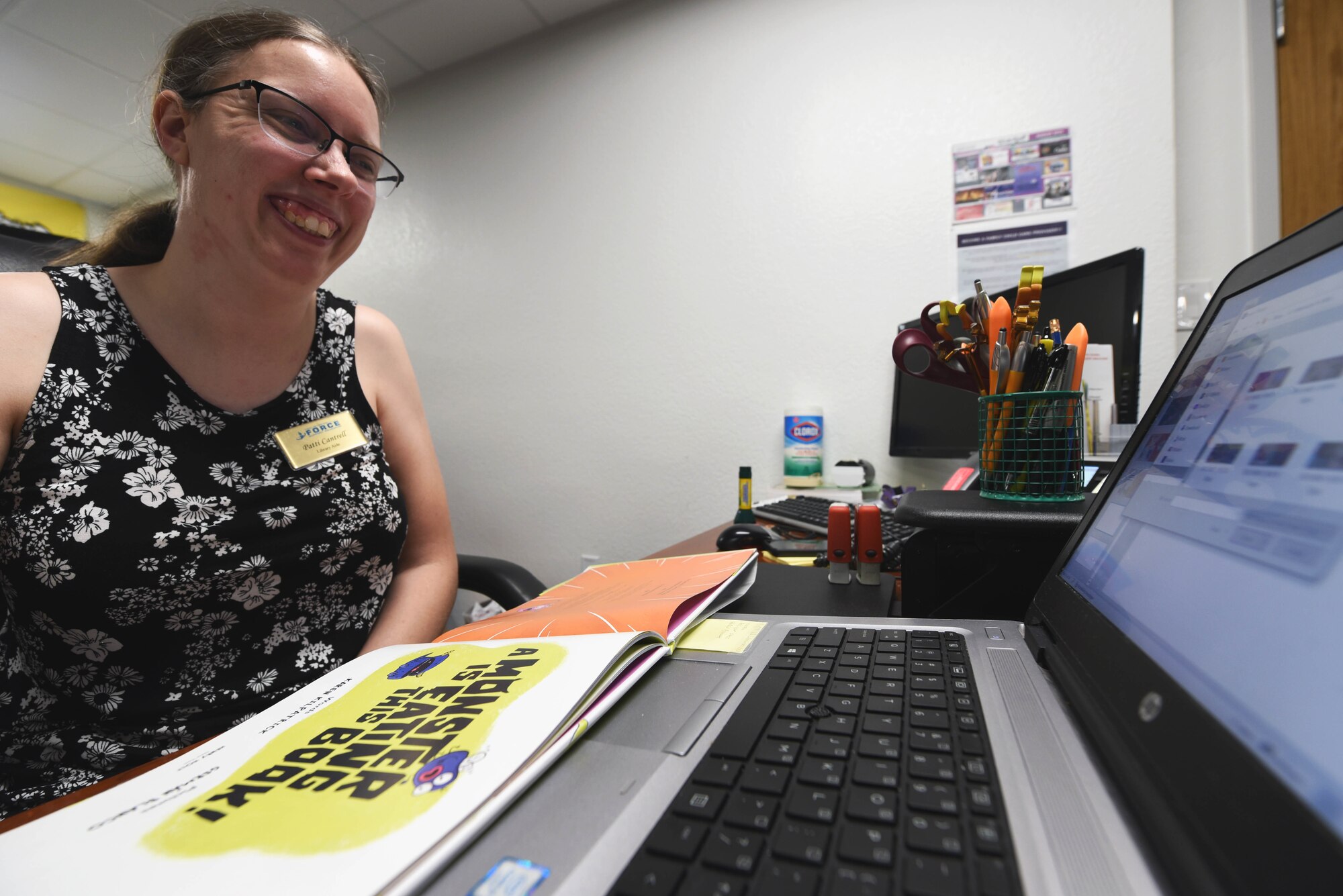 Library staff member works on computer