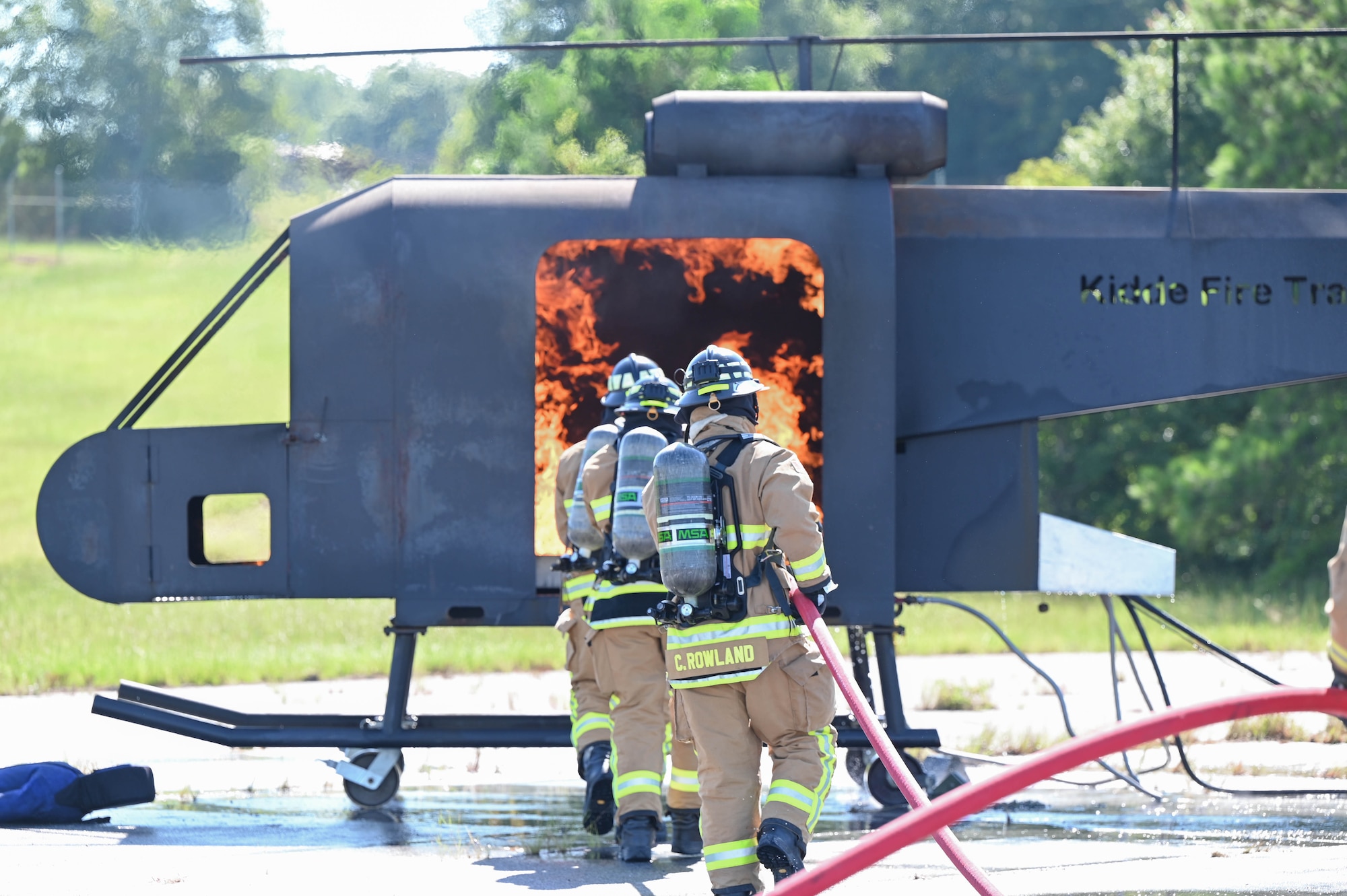 Firefighters extinguish a fire.