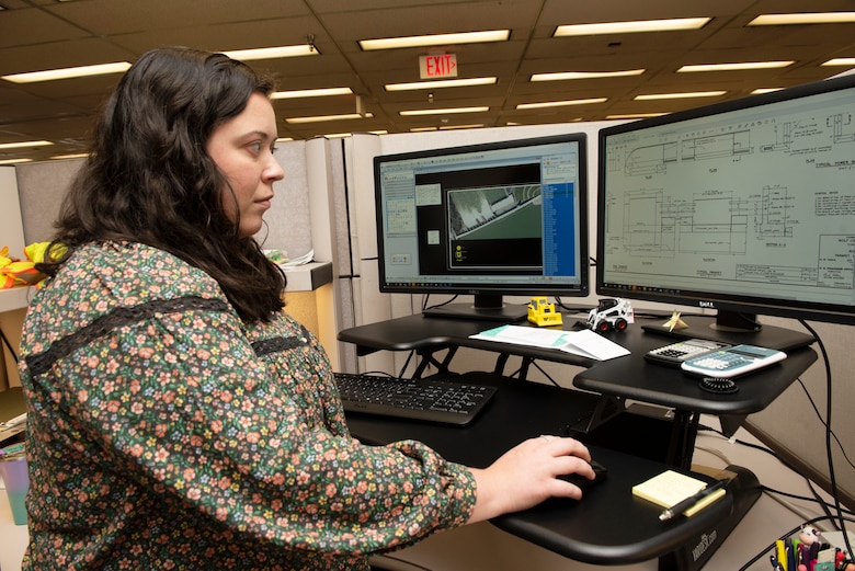 Elizabeth R. Boeglin, civil engineer in the Engineering and Construction Division, is the U.S. Army Corps of Engineers Nashville District Employee of the Month for June 2022. She is being lauded for plan development and design work in support of the Wolf Creek Dam Dissolved Oxygen Project. She is seen here working on plans and specifications Aug. 23, 2022, at the Nashville District Headquarters in Nashville, Tennessee. (USACE Photo by Lee Roberts)