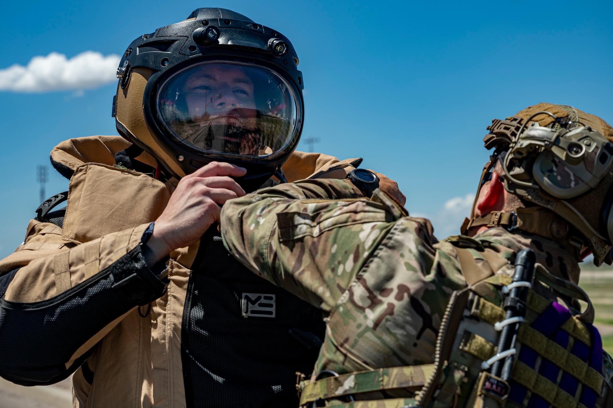 Airman putting on bomb suit