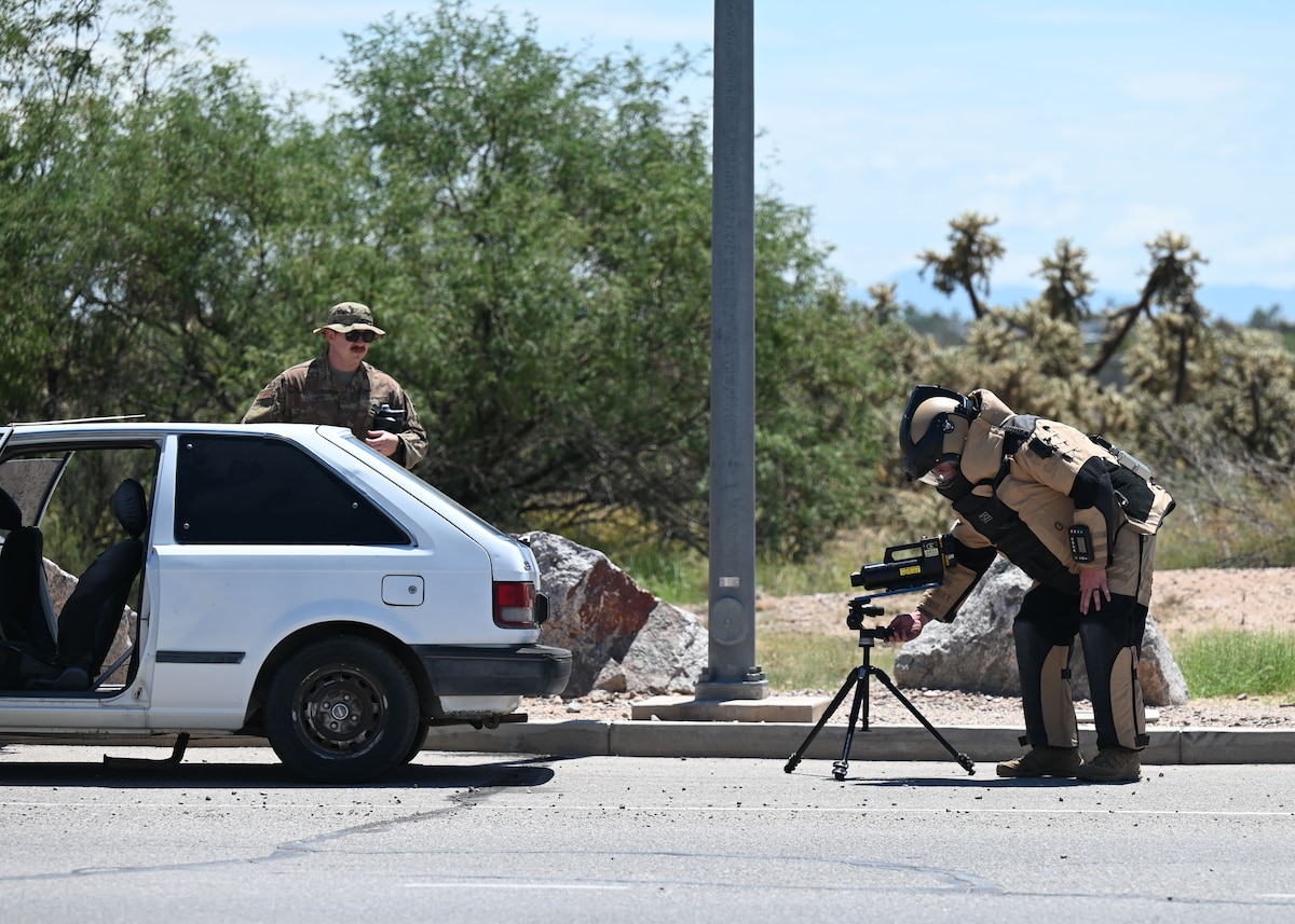 A photo of a man in a bomb suit.