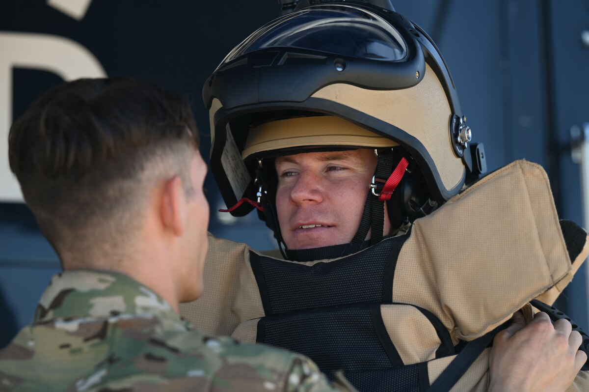 A photo of a man in a bomb suit.