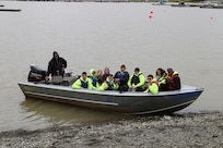 Sgt. 1st Class Joseph Sallaffie, then a staff sergeant, navigates his boat in the Kuskowim River to return participants from the Alaska National Guard Warrior and Family Services cultural camp after visiting Sallaffie’s subsistence fish-camp near Bethel, July 21, 2016.