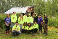 Sgt. 1st Class Joseph Sallaffie, then a staff sergeant, right, and his wife, Rachel, to the left of him, spend time demonstrating the process of drying and cutting salmon strips to participants of the Alaska National Guard Warrior and Family Services cultural camp at thier subsistence fish camp on the shores of the Kuskowim River near Bethel, July 21, 2016. The youth learned the importance of subsistence living during the five-day program that focused on cultural-based service and learning projects.