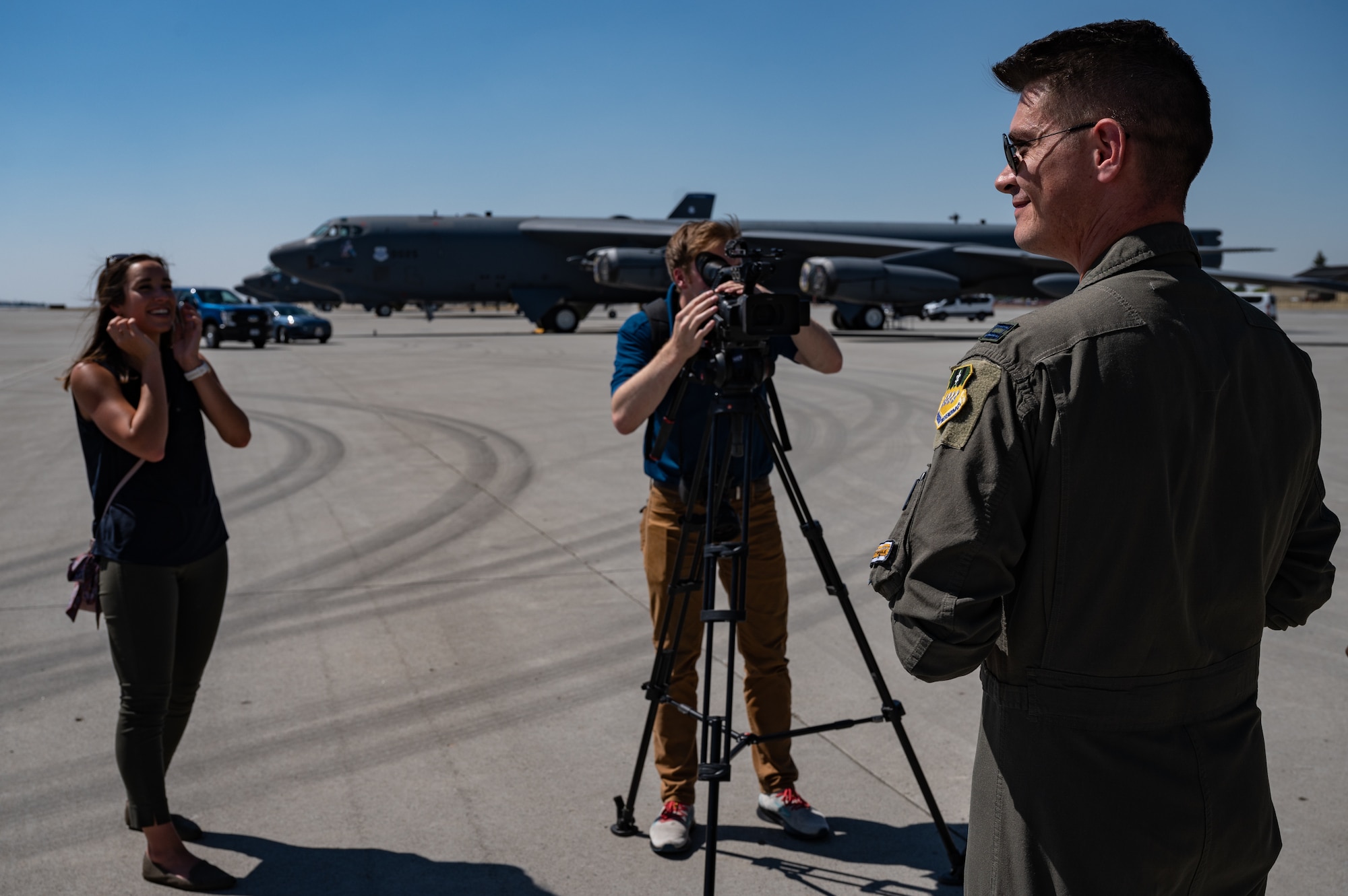 Capt. Tanner Devotie, 96th Bomb Squadron aircraft commander, speaks with local news media during an interview at Fairchild Air Force Base, Washington, Aug. 17, 2022. Four separate media outlets covered the first return of the B-52H Stratofortress to Fairchild in 12 years. (U.S. Air Force photo by Senior Airman Chase Sullivan)