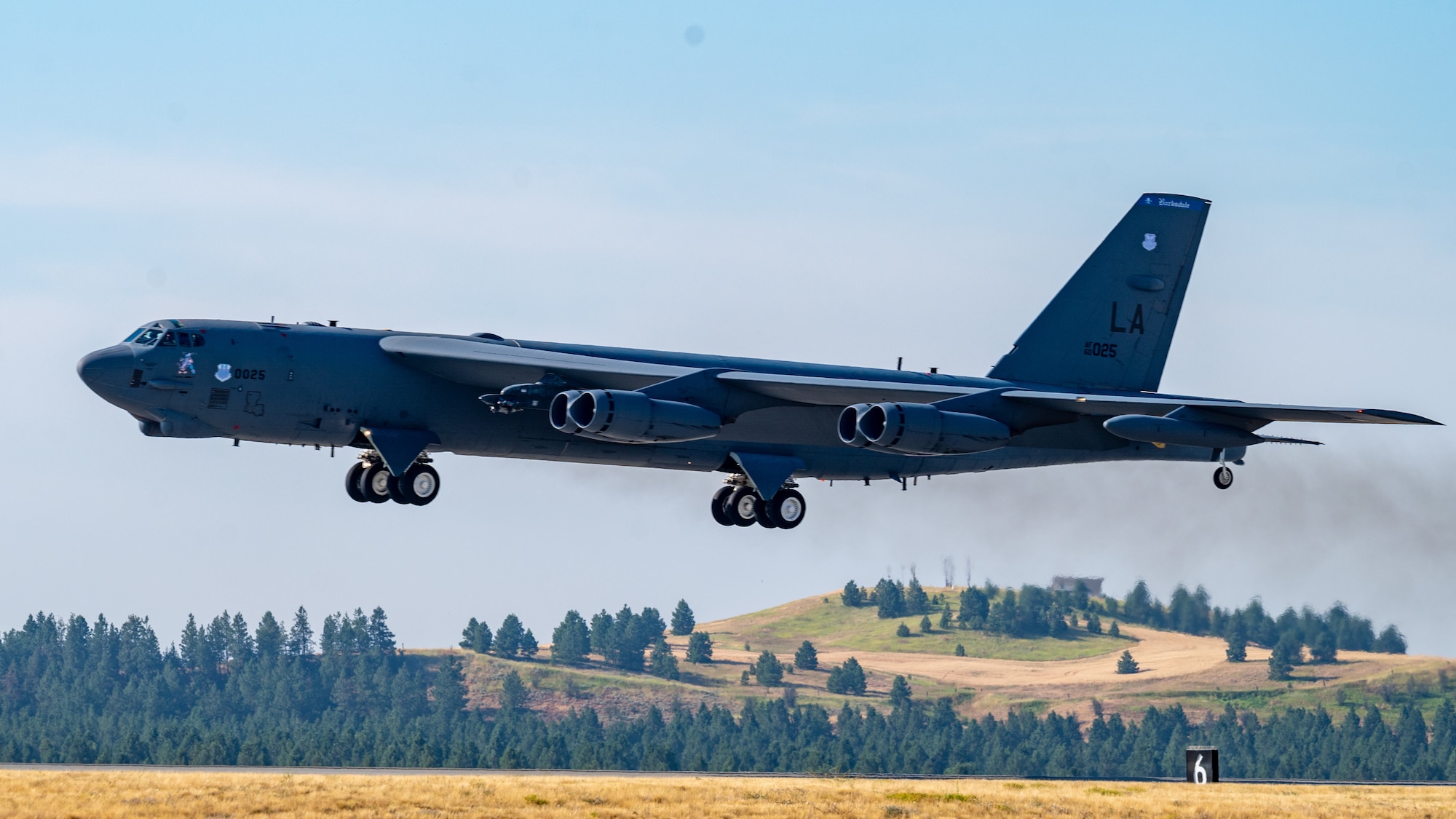A B-52H Stratofortress takes off from Fairchild Air Force Base, Washington during an Agile Combat Employment exercise Aug. 18, 2022. When using the ACE concept the B-52s can land at a non-bomber location, receive repairs, resupply and be back in the air within a few hours. (U.S. Air Force photo by Senior Airman Chase Sullivan)