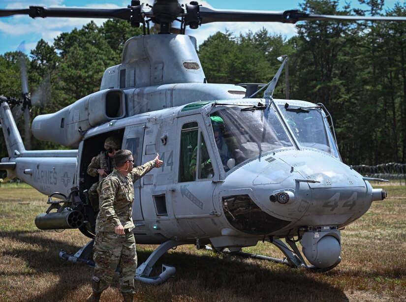U.S. Army Soldiers assigned to the U.S. Army Reserve, 78th Training Division, upload a crate of mail onto a UH-60 during Exercise Postal Warrior 2022 at Joint Base McGuire-Dix-Lakehurst, N.J. on 10 Aug, 2022. Postal Warrior 2022 is a standalone, task-focused exercise, designed to train and challenge postal units in the skill sets and competencies needed to support Theater Postal Operations and increase individual and collective readiness. Approximately 600 soldiers participated in the exercise, which included both classroom and simulated field training at the Army Support Activity Fort Dix Ranges. (U.S. Air Force photo by Staff Sgt. Sabatino Dimascio)