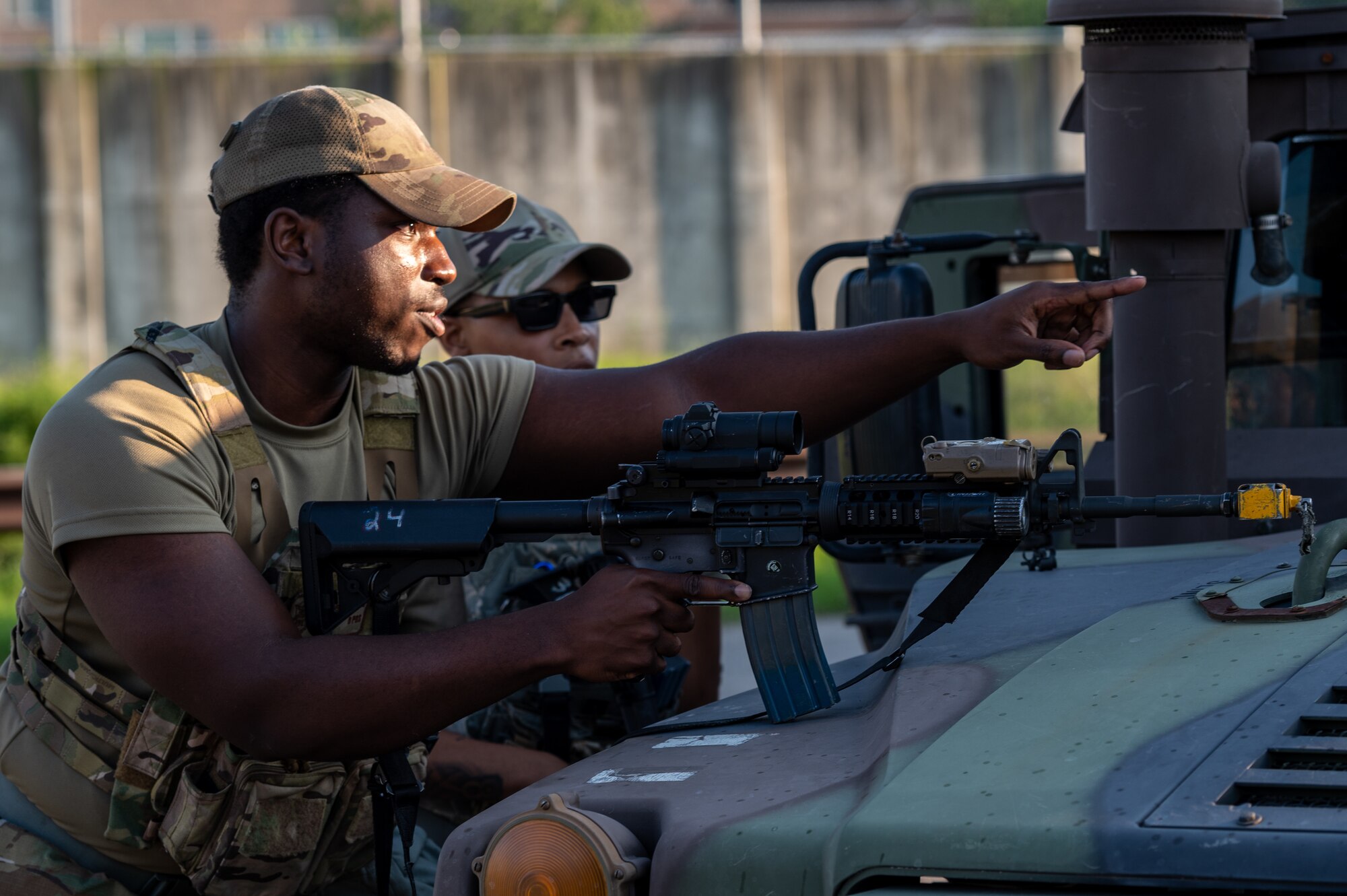 Airman 1st Class Alexander Dorrelus, 51st Security Forces Squadron response force team leader, prepares a plan of action with his team while responding to a simulated attack during a base-wide training event at Osan Air Base