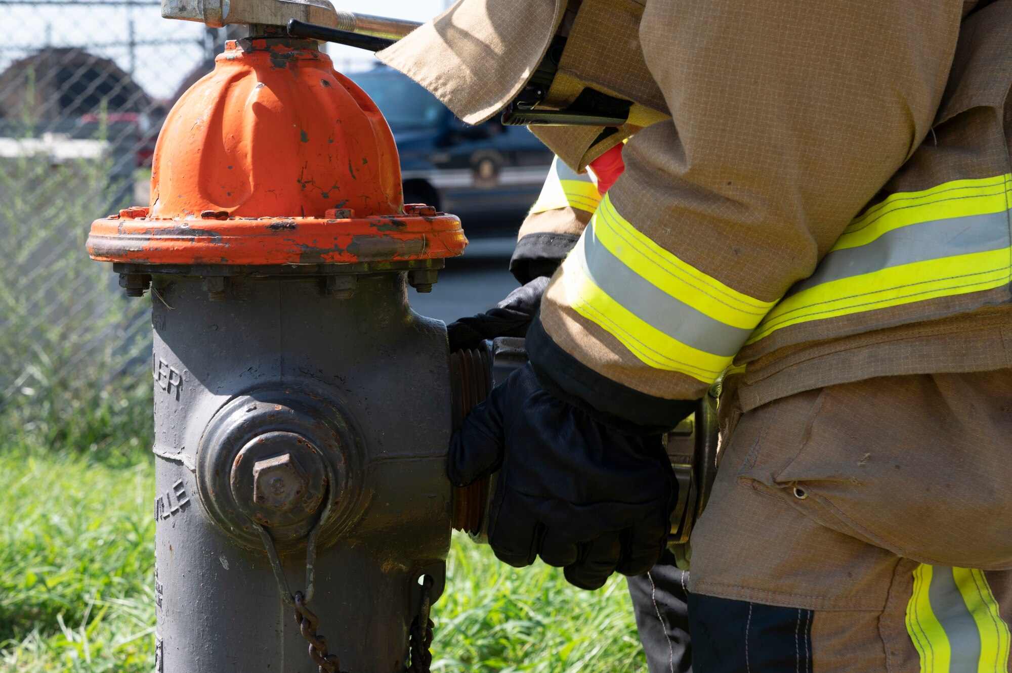 A firefighter from the 51st Civil Engineer Squadron attaches a hose to a fire hydrant during a fire response training event at Osan Air Base