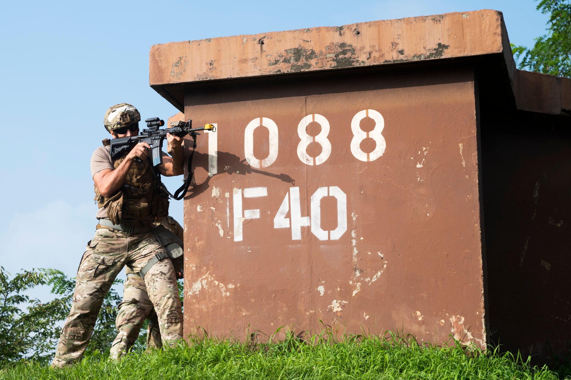 Airmen assigned to the 51st Security Forces Squadron take cover during a simulated attack as part of a base-wide training event at Osan Air Base
