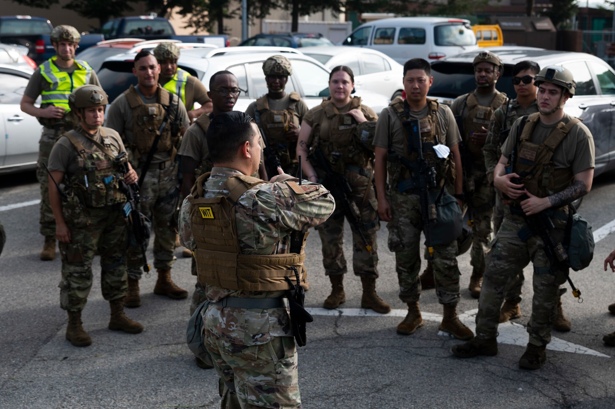 Airmen assigned to the 51st Security Forces Squadron gather for a performance review following a training event at Osan Air Base.
