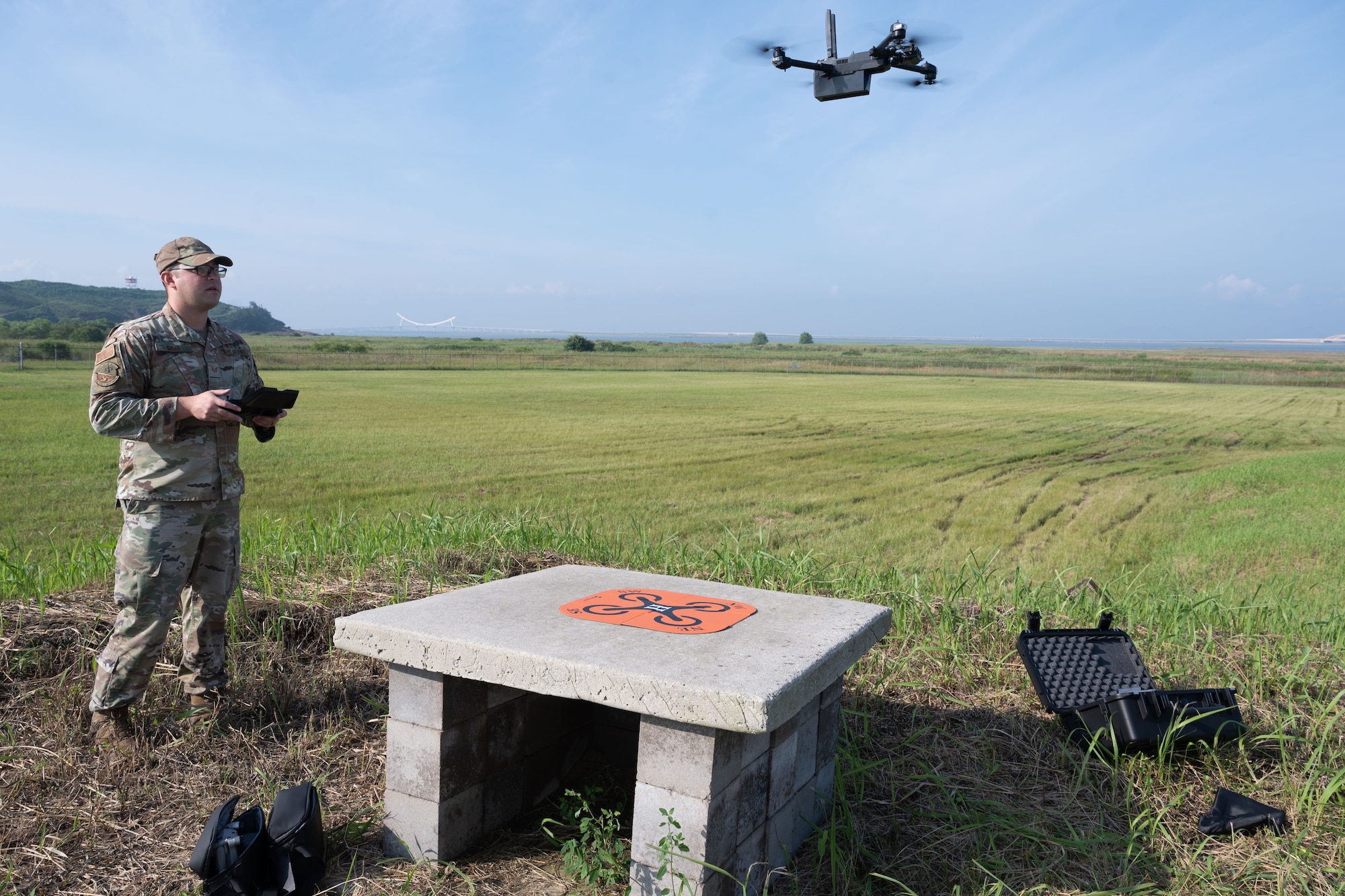 An Airman flies a drone.