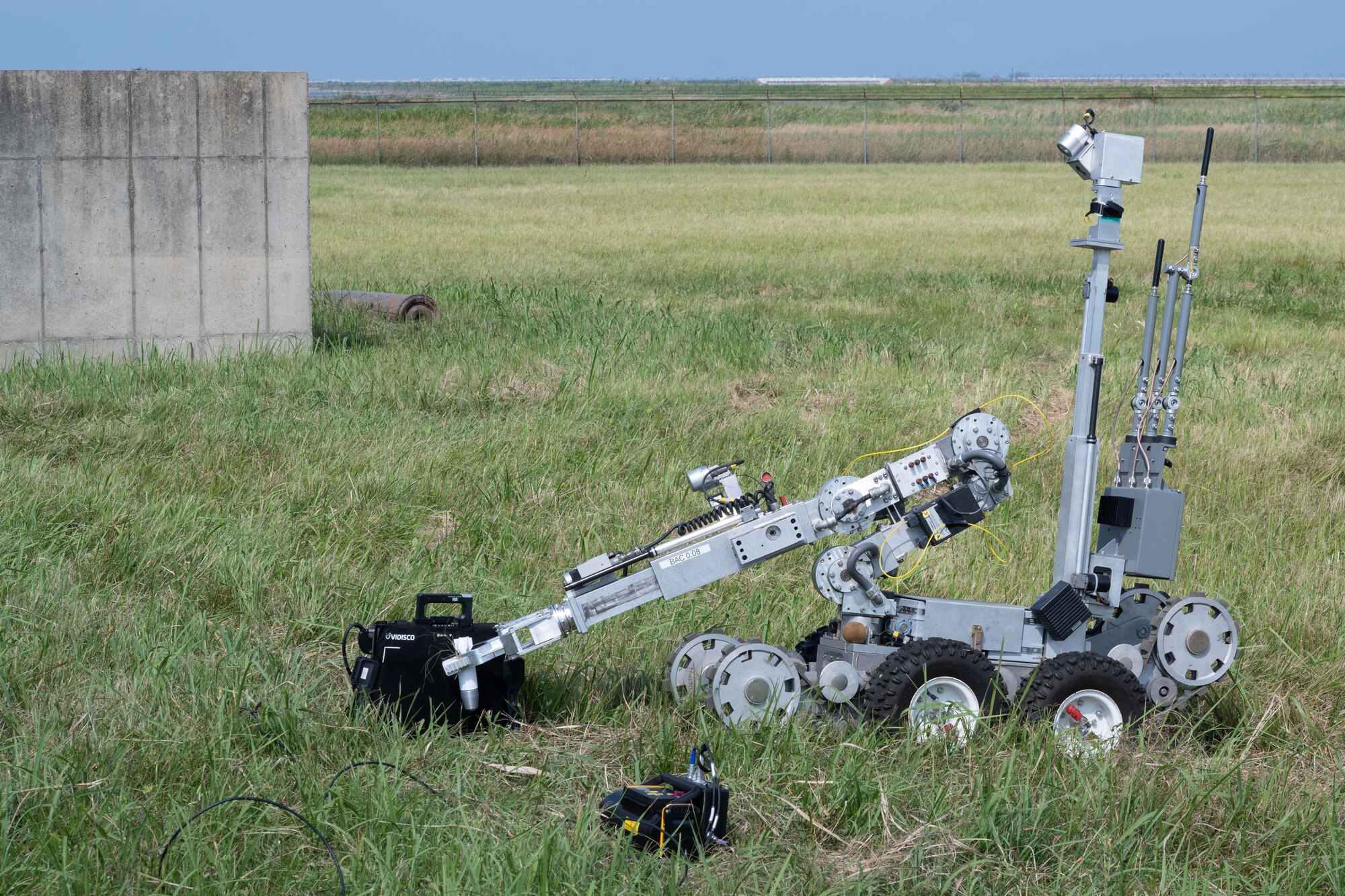 The F6 robot picks up a fake drone-dropped munition and places it in front of an x-ray.