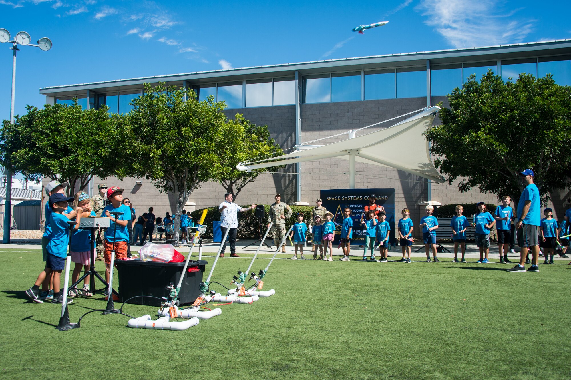 Students from Hilltop Christian Preschool and Day Camp enjoy a fun introduction to science, technology, engineering and mathematics (STEM), as part of the SSC one-year anniversary event at Los Angeles Air Force Base, El Segundo, Calif., August 12, 2022. The SSC STEM team provided a space-themed activity with a rocket launch at the base soccer field. (U.S. Space Force photo by Van Ha)