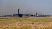 Four B-52H Stratofortresses taxi down the runway during an Agile Combat Employment exercise at Fairchild Air Force Base, Washington, Aug. 18, 2022. This exercise marks the first time the B-52 has operated out of Fairchild since 2010. (U.S. Air Force photo by Senior Airman Chase Sullivan)
